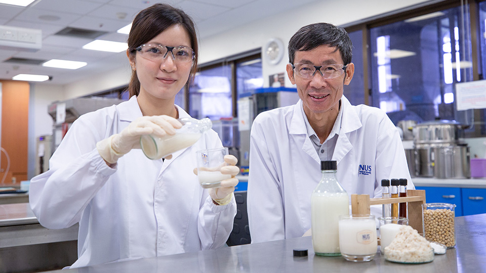 Associate Professor Liu Shao Quan and doctoral student Ms Vong Weng Chan from the NUS Food Science and Technology Programme have devised a unique cocktail of enzymes, probiotics and yeast to produce an okara beverage rich in gut-friendly nutrients. Photo courtesy: NUS