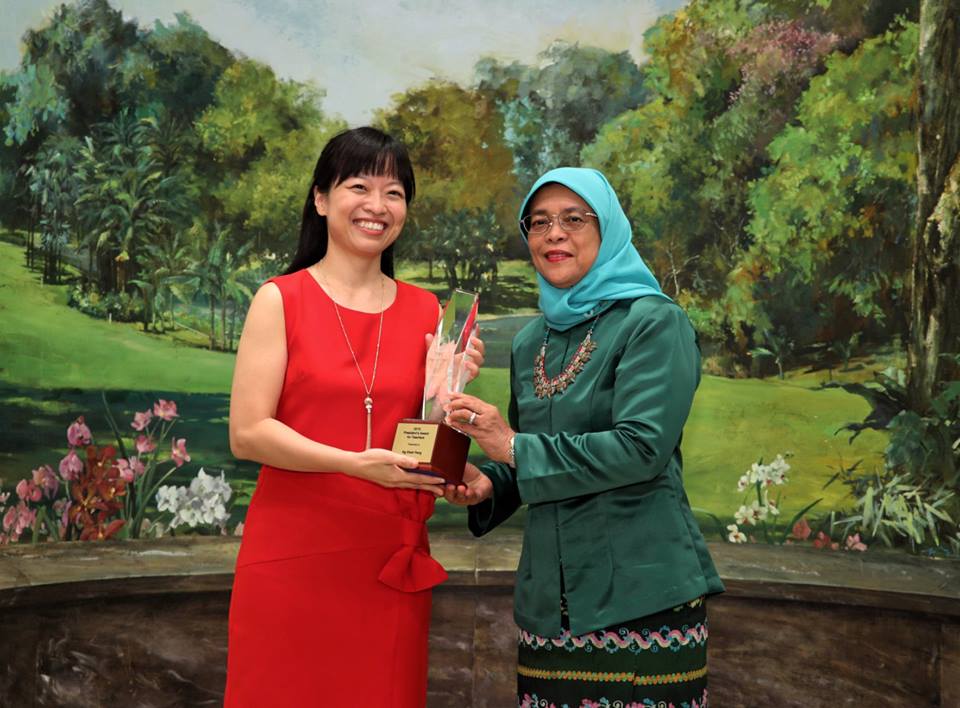 President of Singapore Halimah Yacob presenting President’s Award for Teacher (PAT) to Ng Sheh Feng. Photo courtesy: Facebook page of Halimah Yacob