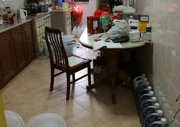 Scene of the kitchen of HDB flat which was used as manufacturing facility for cough syrups. Photo courtesy: HSA