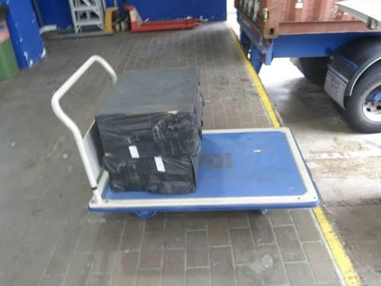 During the raid of a self-storage facility in Kallang Sector, Singapore Customs officers saw a man pushing a trolley loaded with what appeared to be boxes wrapped in black trash bags to the loading bay of the building. Photo courtesy: Singapore Customs 
