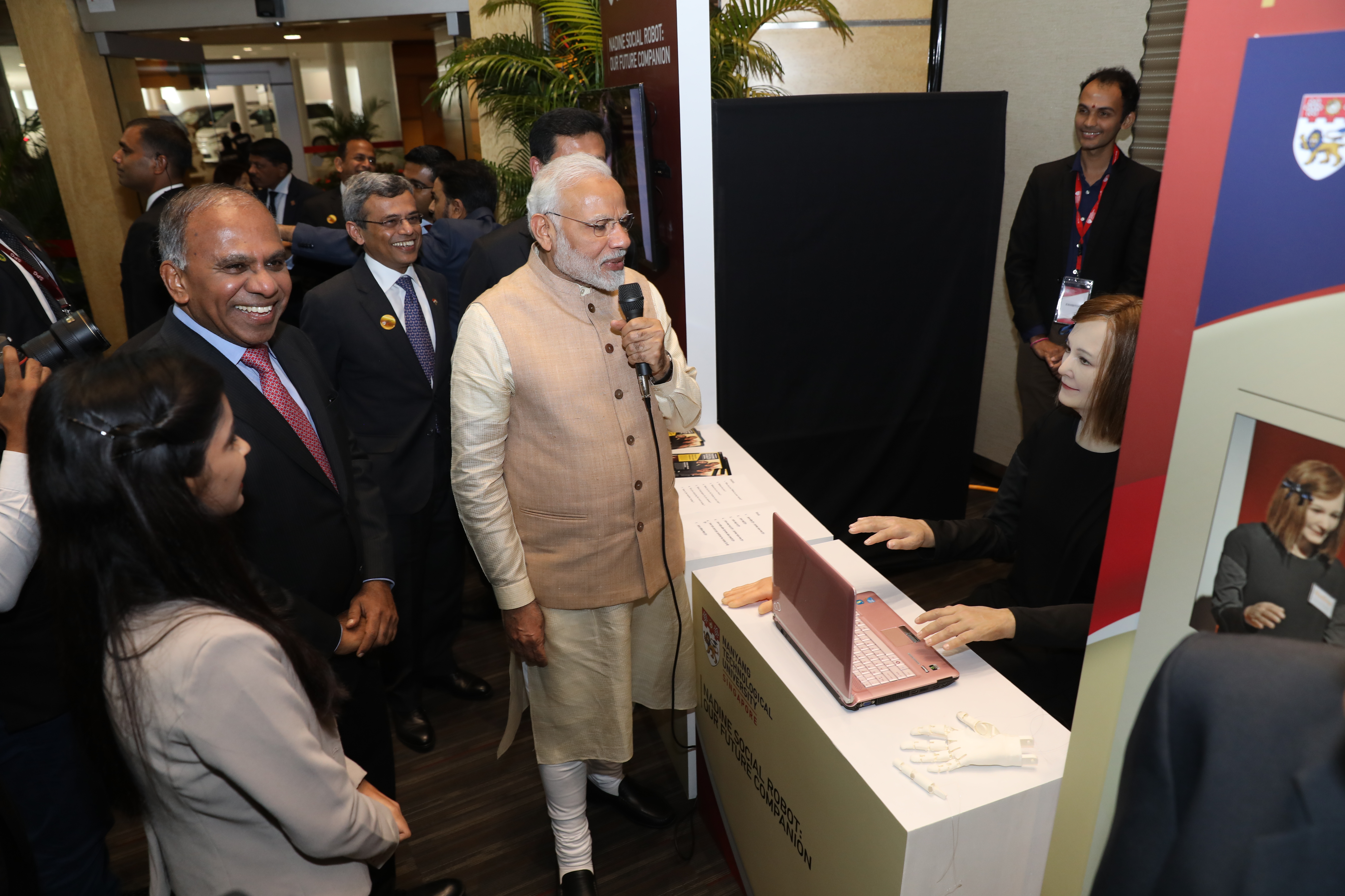 PM Modi interacting with Nadine, Nanyang Technological University’s humanoid social robot during his last visit to Singapore in June 2018. H.E. Jawed Ashraf, Indian High Commissioner to Singapore is also seen in the photograph. Photo courtesy: NTU