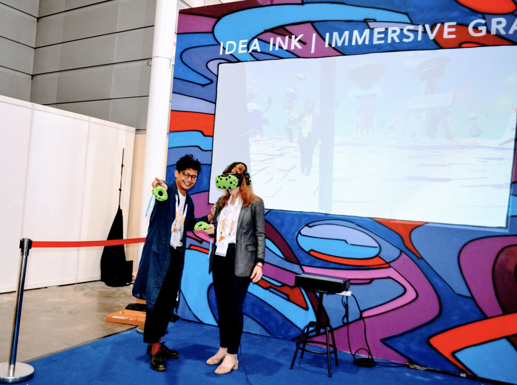 Idea Ink visual consulting and information design start-up giving a visitor to their booth an 