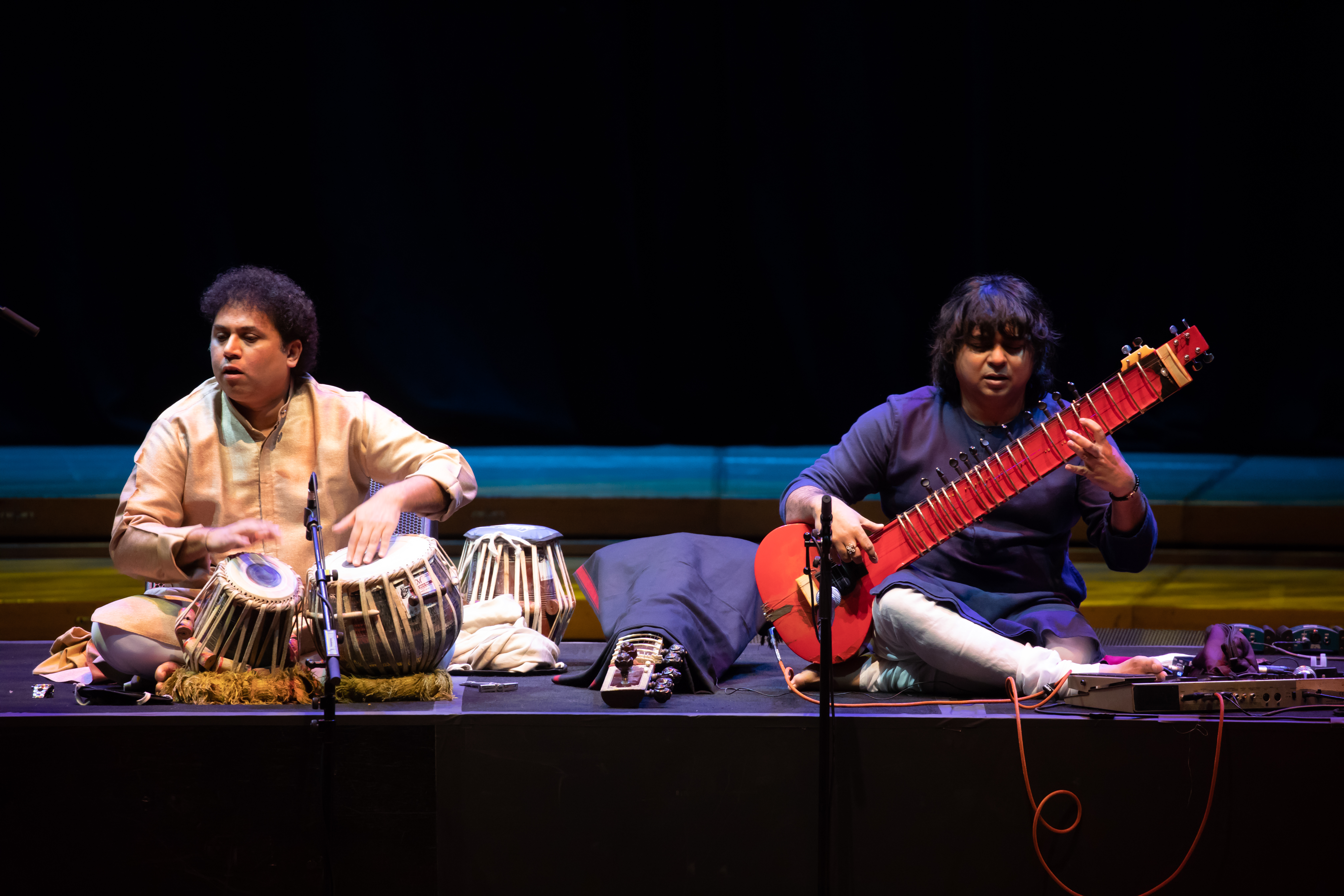 Renowned sitar maestro Niladri Kumar applying his dexterous, agile and magical fingers on the fiery red electric 'zitar' to create soul-stirring compositions during his performance at Kalaa Utsavam in Singapore. He is accompanied with Satyajit Talwalkar on the tabla. Photo courtesy: Esplanade Theatres on the Bay