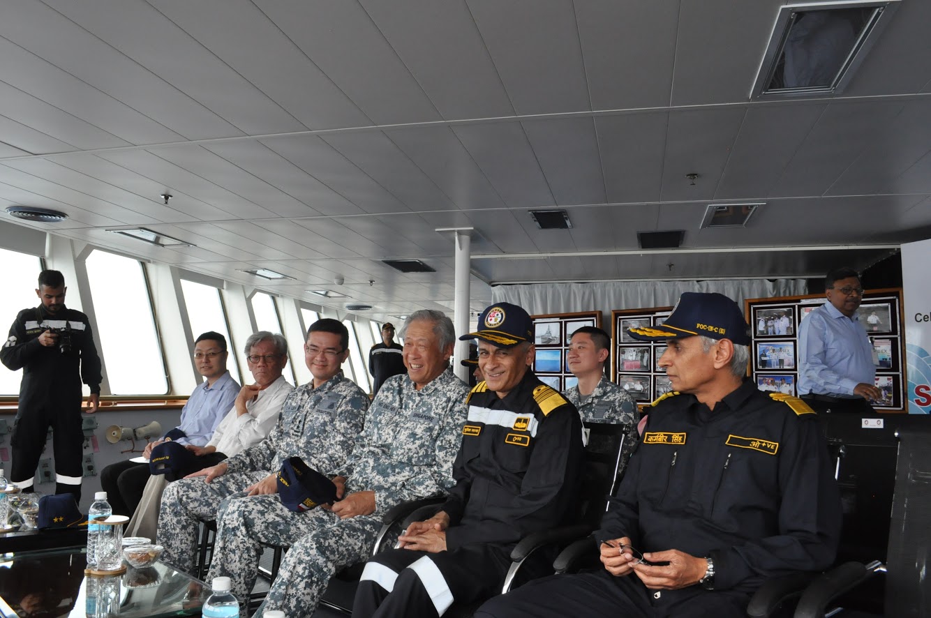 Minister for Defence Dr Ng Eng Hen (centre) being briefed on the combined missile firing by the Republic of Singapore Navy and Indian Navy (IN) on board IN’s Deepak-class tanker, INS Shakti, during the 25th Singapore-India Maritime Bilateral Exercise. Photo courtesy: Mindef