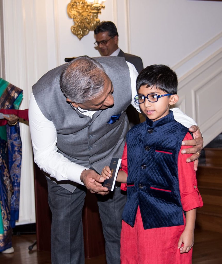 Young recipient of passport at the inauguration of Passport Seva Project by Minister of State for External Affairs V K Singh ai Indian Embassy, Washington DC (Photo courtesy: Indian Embassy, Washington DC