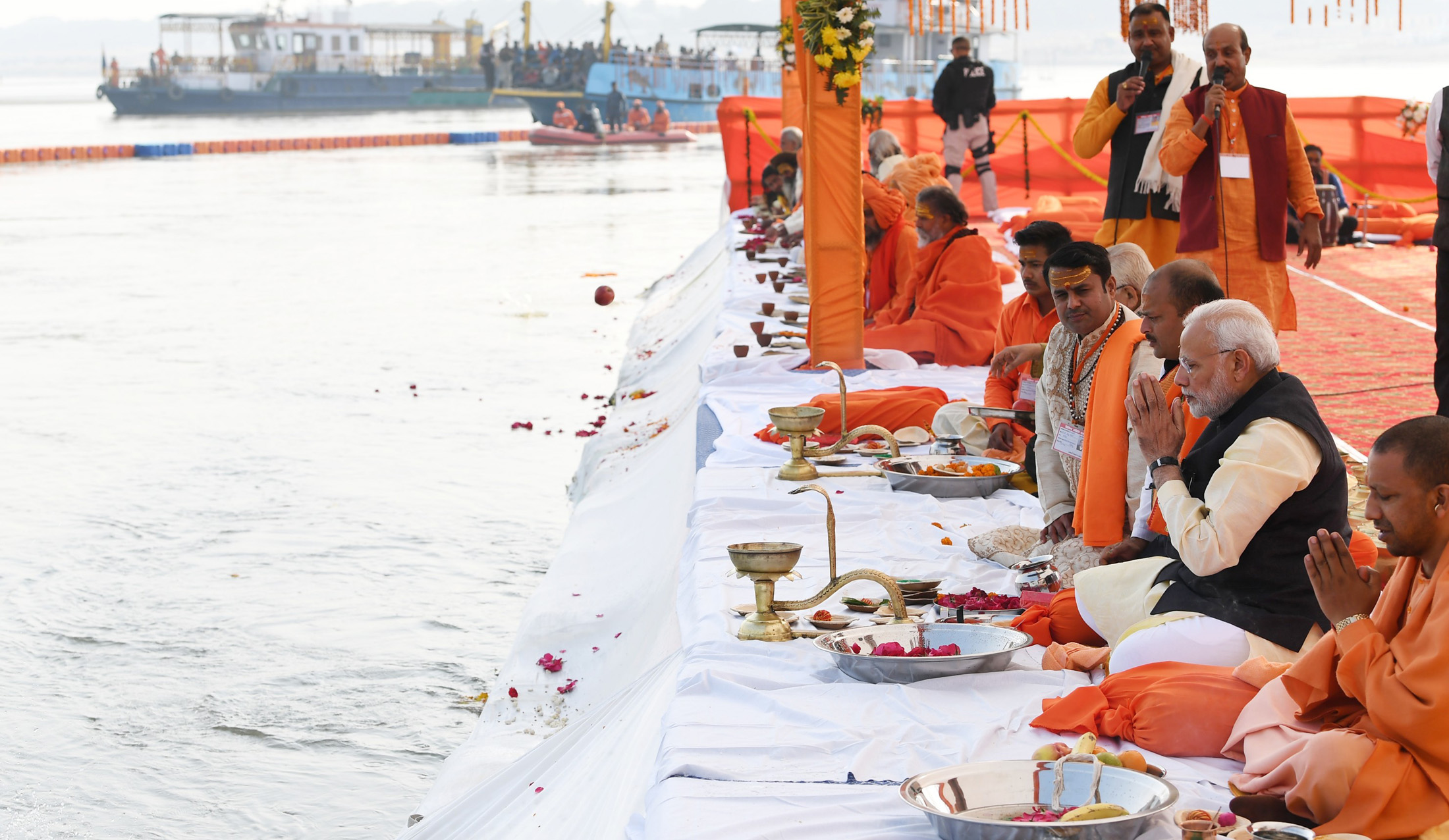 Prime Minister Narendra Modi and Chief Minister of Uttar Pradesh Yogi Adityanath performing the Ganga Pujan at Prayagraj, in Uttar Pradesh. (Photo courtesy: PIB
