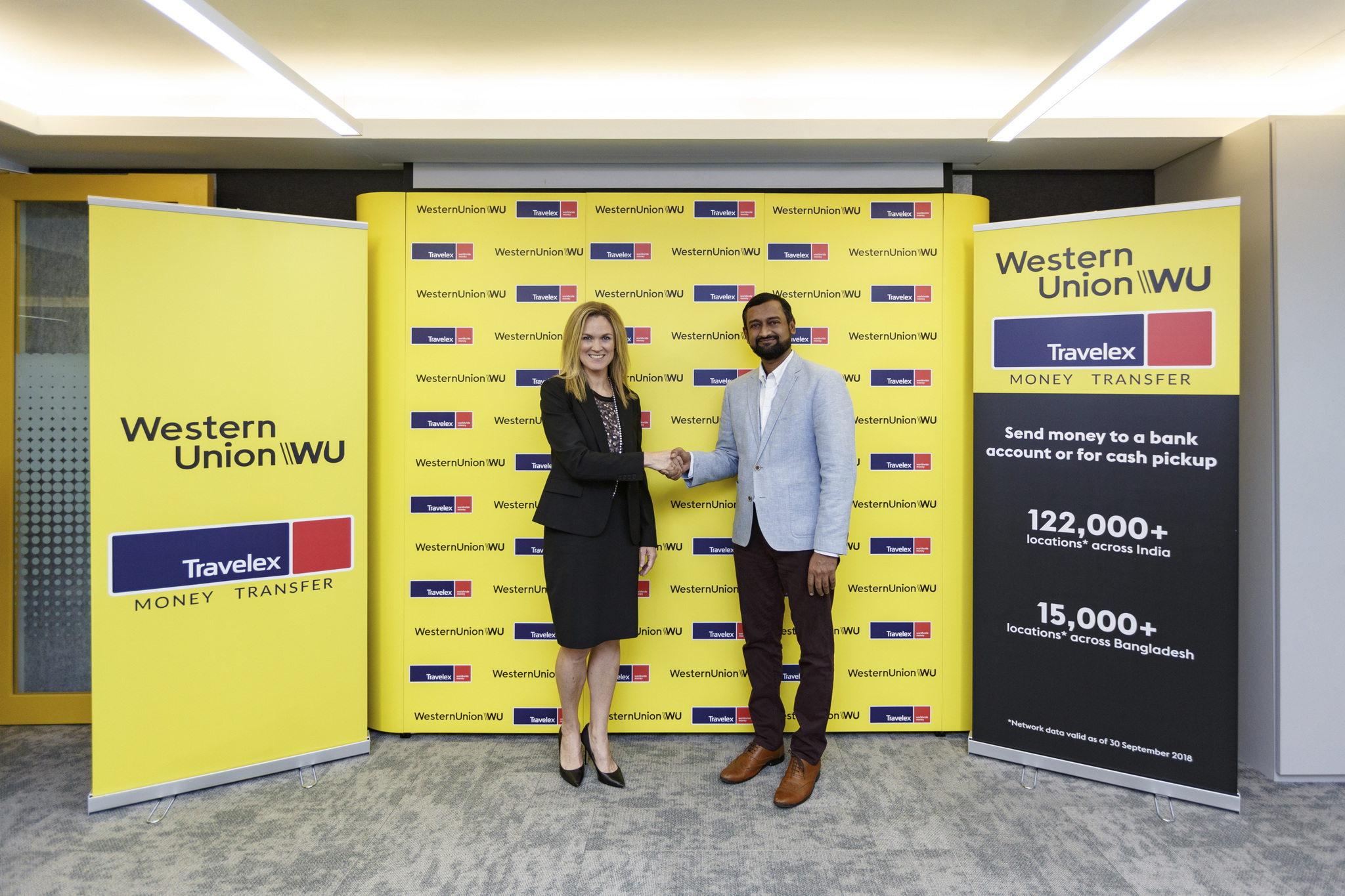  Molly Shea, Senior Vice President and General Manager, Global Money Transfer, Asia Pacific, Western Union and Lakskmi Narayan S, Travelex's Global Head of Remittances sealing the deal on behalf of the two companies which will help co-locating Western Union money transfer services within worker dormitories across Singapore. Photo courtesy: Western Union 
