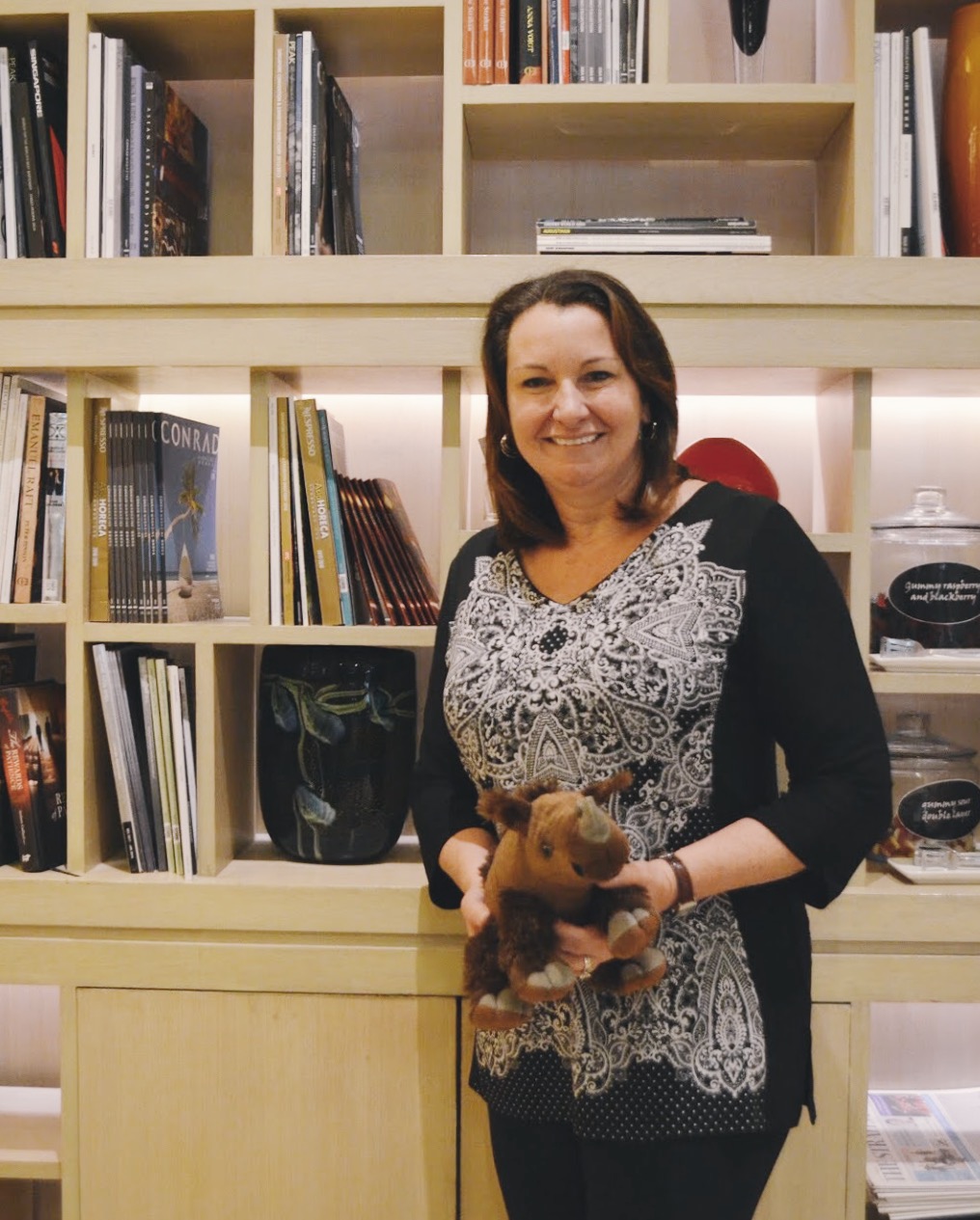 Leanna Jackson, Director of Philanthropy, Society for Conservation Biology, poses with the ICCB 2019 mascot, a Asian Two-horned Rhinoceros. Photo: Connected to India