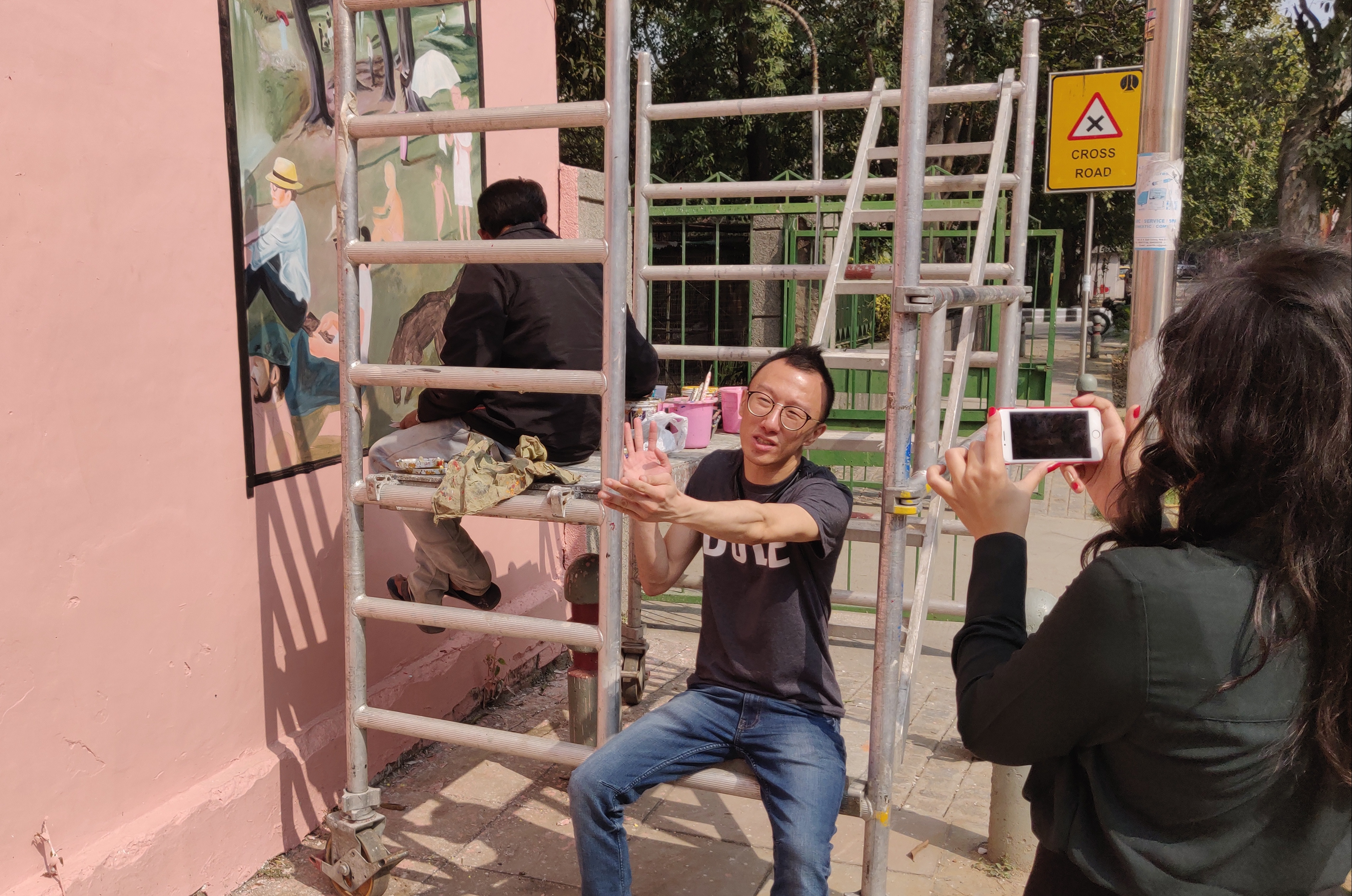 Eugene Soh, a computer programmer turned street artist, talking to Connected to India about a rendering of his works onto the walls of Lodhi Colony. Photo: Connected to India