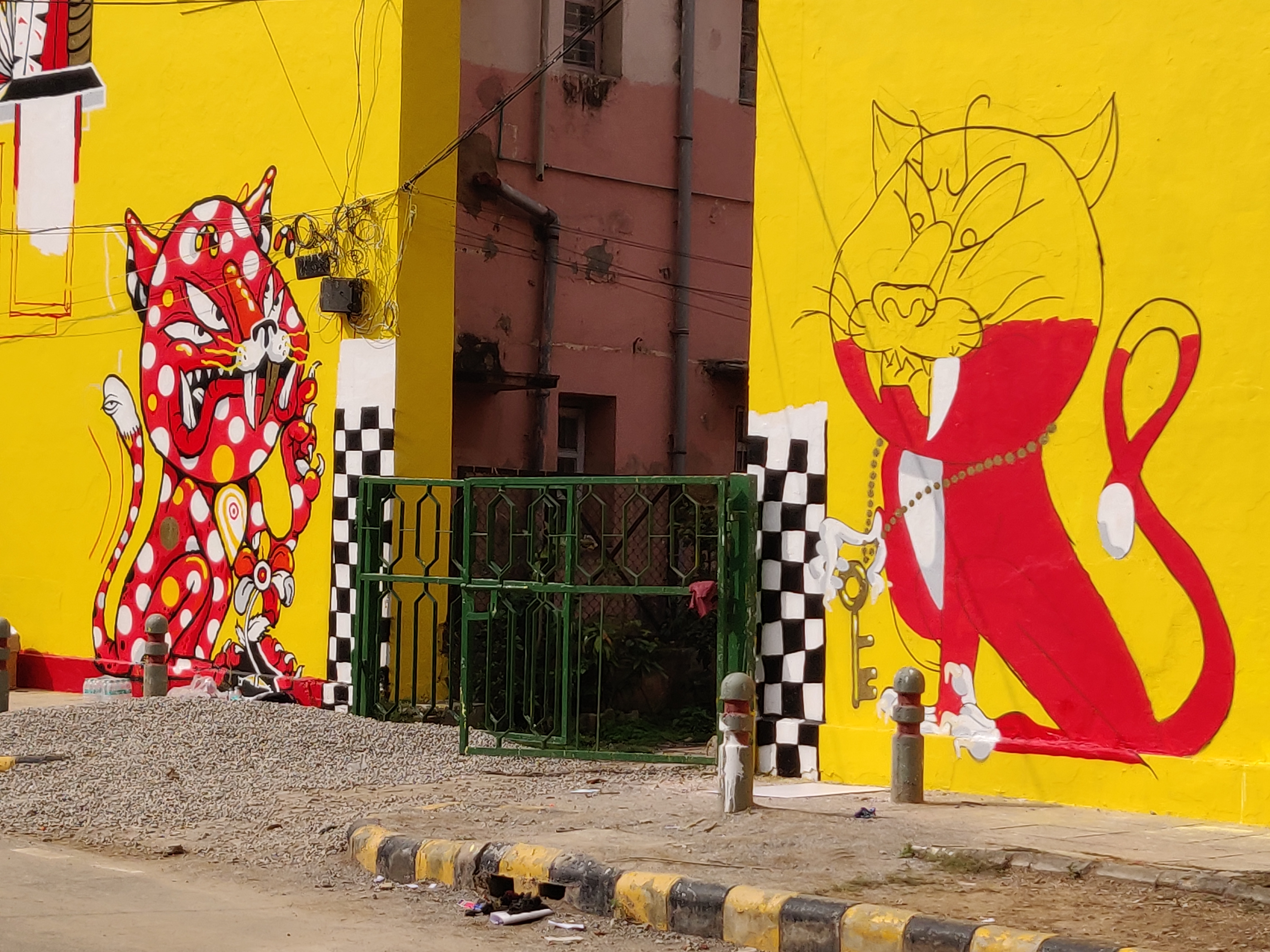 Artistic renderings of Singapore lions guarding the gates of Lodhi Colony at Singapore Lane of the Lodhi Art Festival. Photo: connected to India