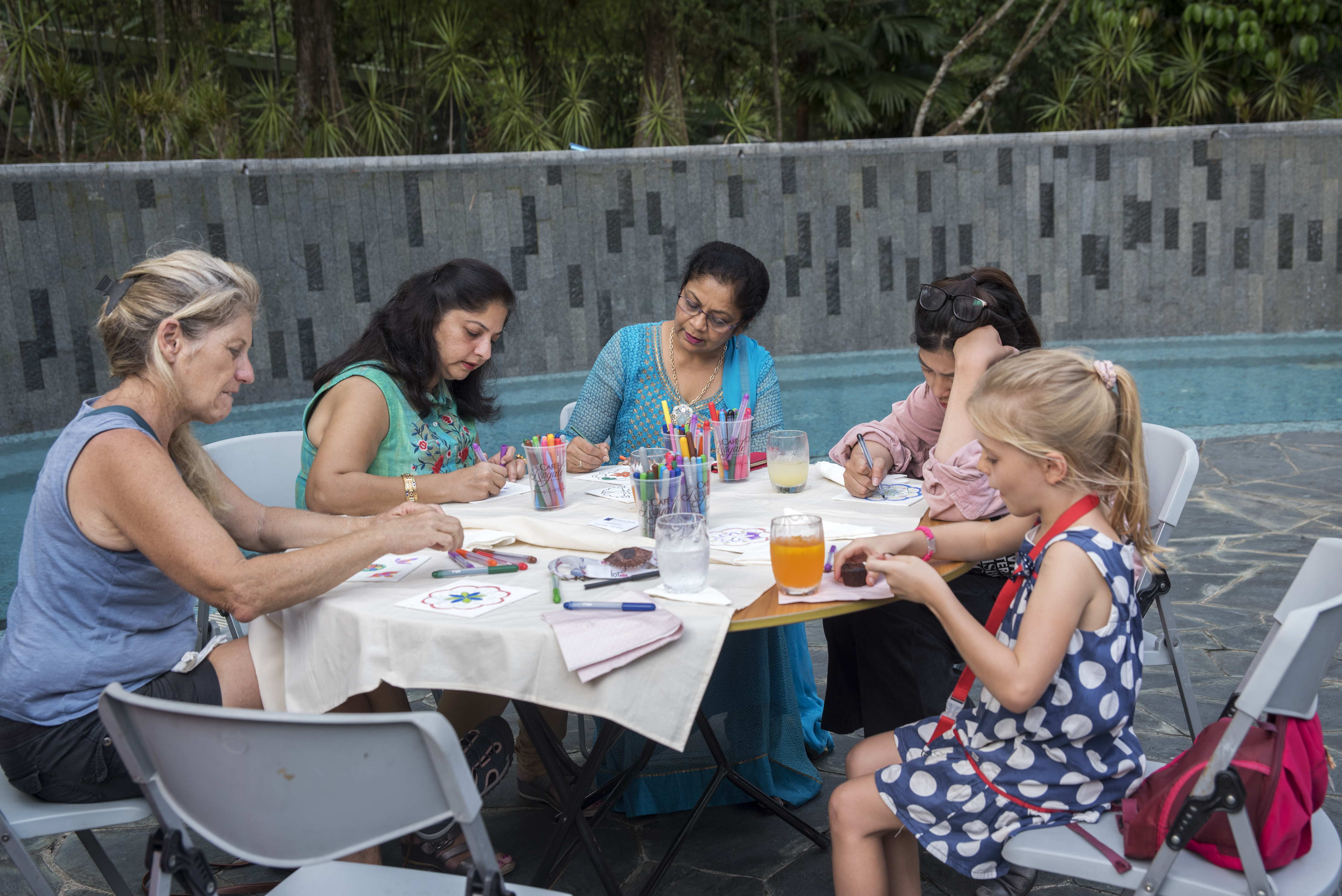 Adults and kids enthusiastically participated in the rangoli workshop. Photo courtesy: IDF, Singapore