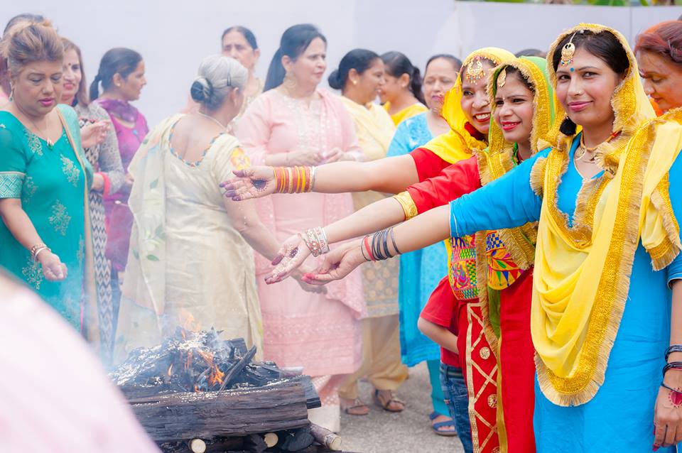   Women participating in Lohri festivities organised by the Ladies' Wing of SKA. Photo courtesy: SKA