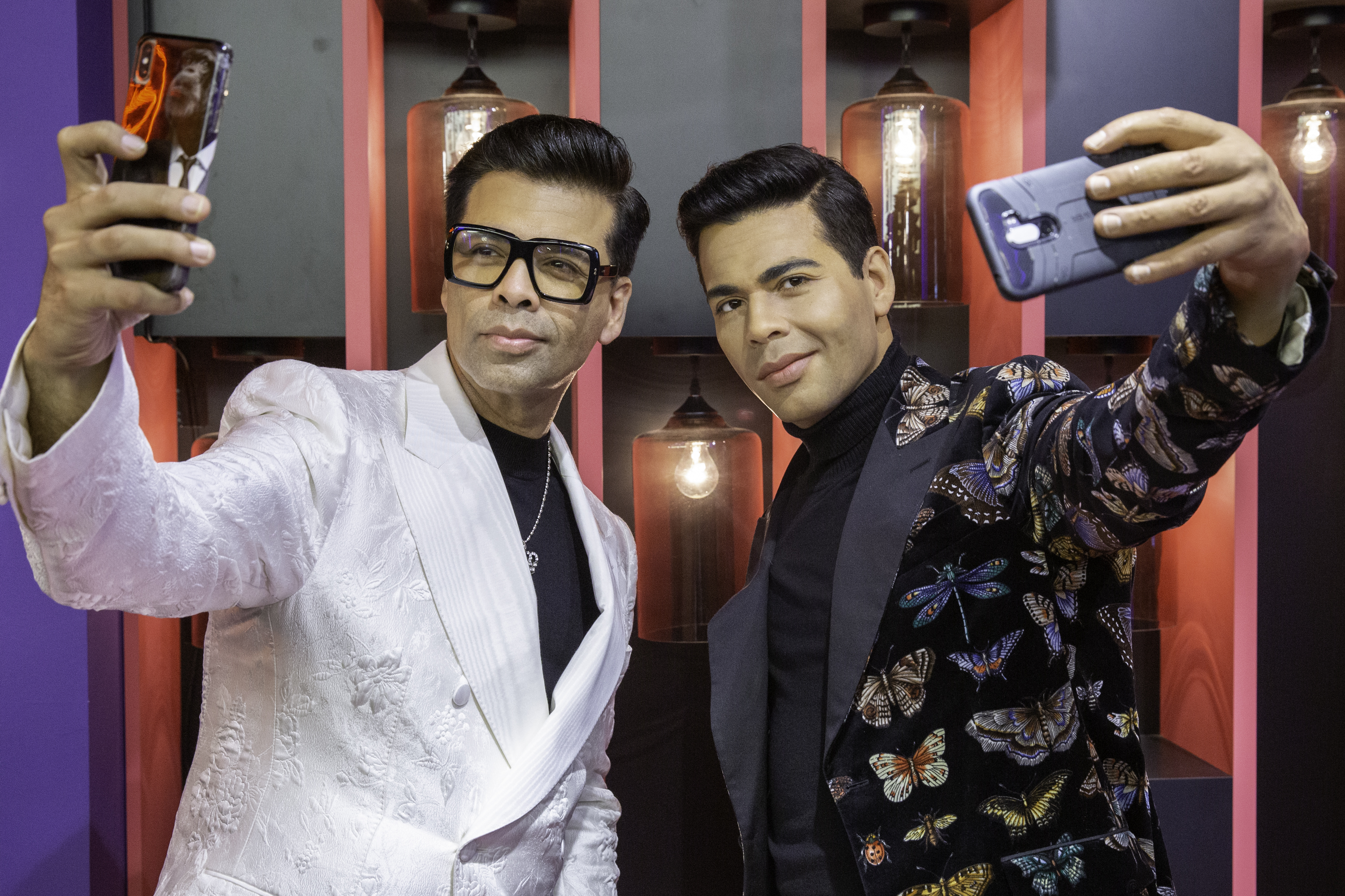 Karan Johar posing with his wax statue, which is a star attraction in multiple scenarios of the Bollywood Experience at Madame Tussauds Singapore. Photo courtesy: MAdame Tussauds
