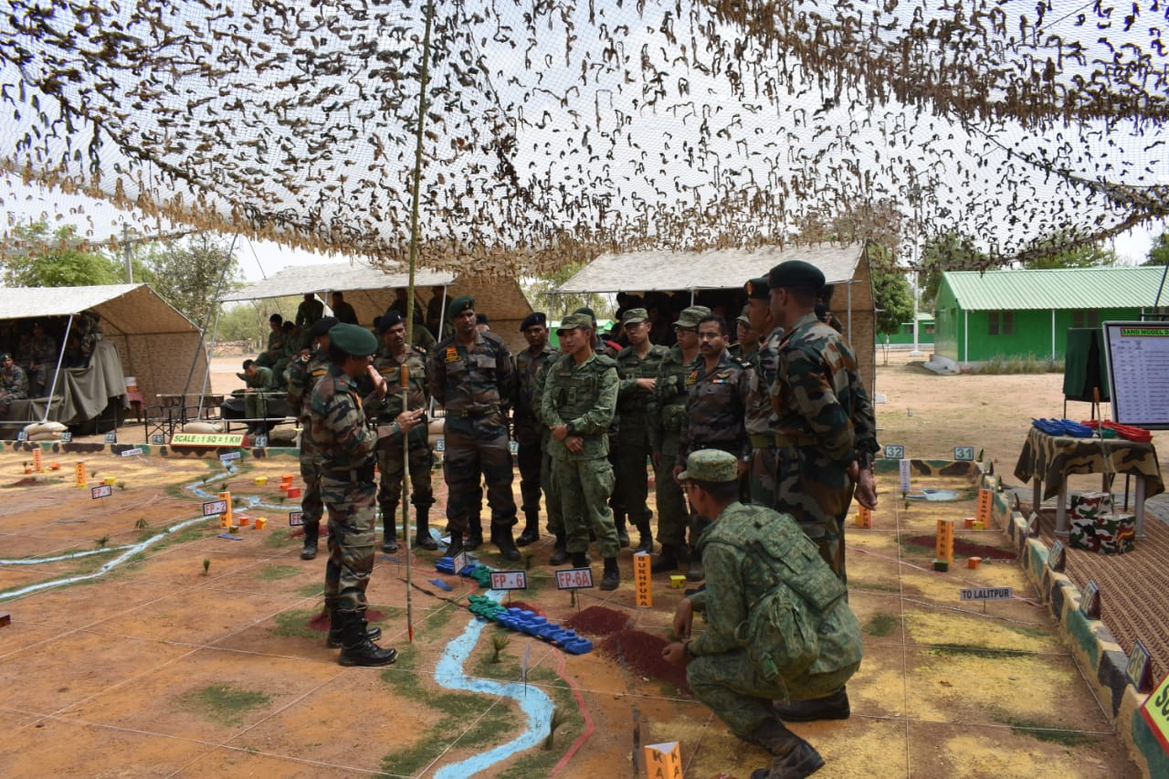  Indian and Singapore army officers holding joint sand model discussion during the joint army exercise. Photo courtesy: Ministry of Defence, India