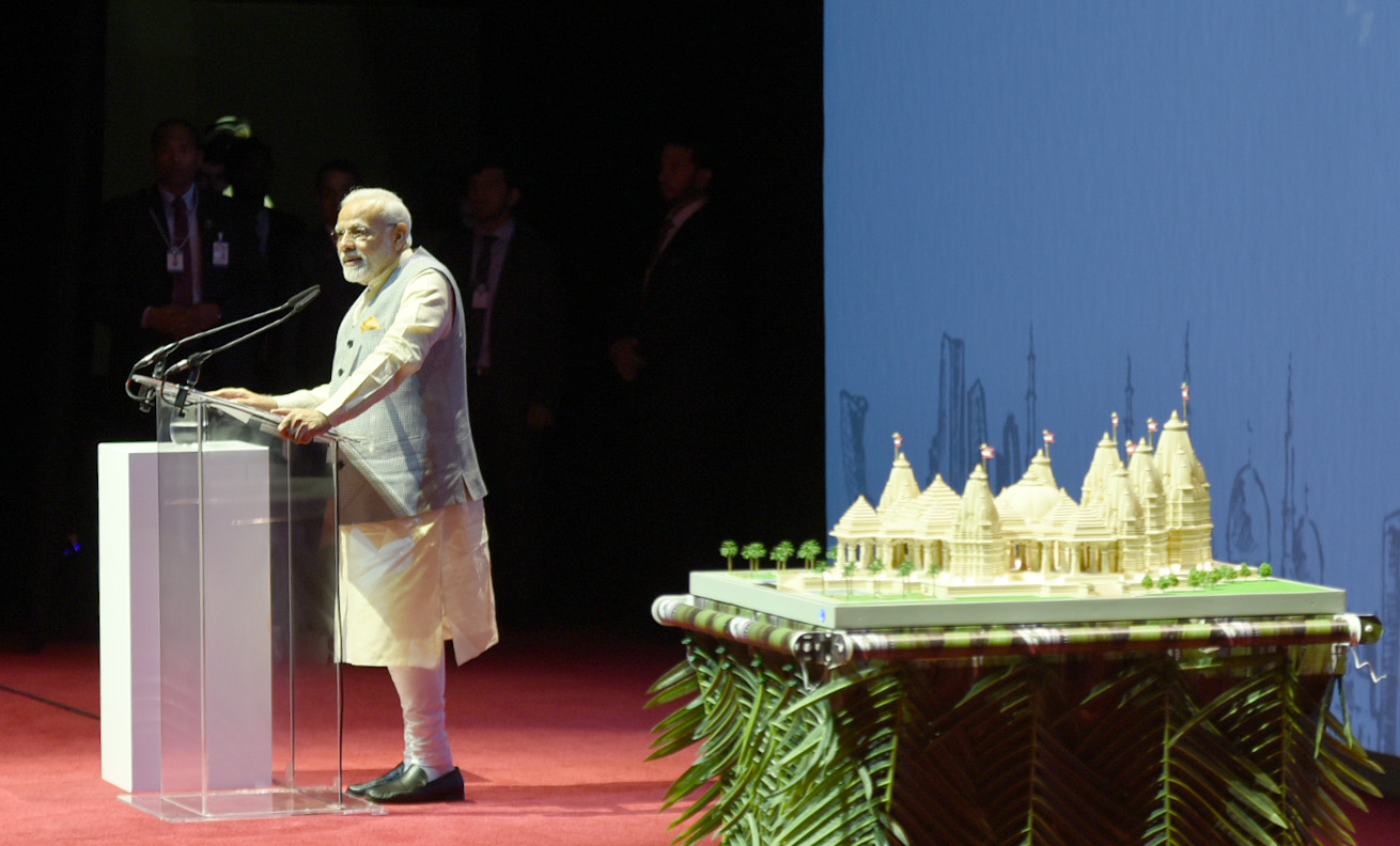 Prime Minister Narendra Modi, with replica of temple on his side, addressing the Indian community at the iconic Dubai Opera, in Abu Dhabi, United Arab Emirates on February 11, 2018. Photo courtesy PMO