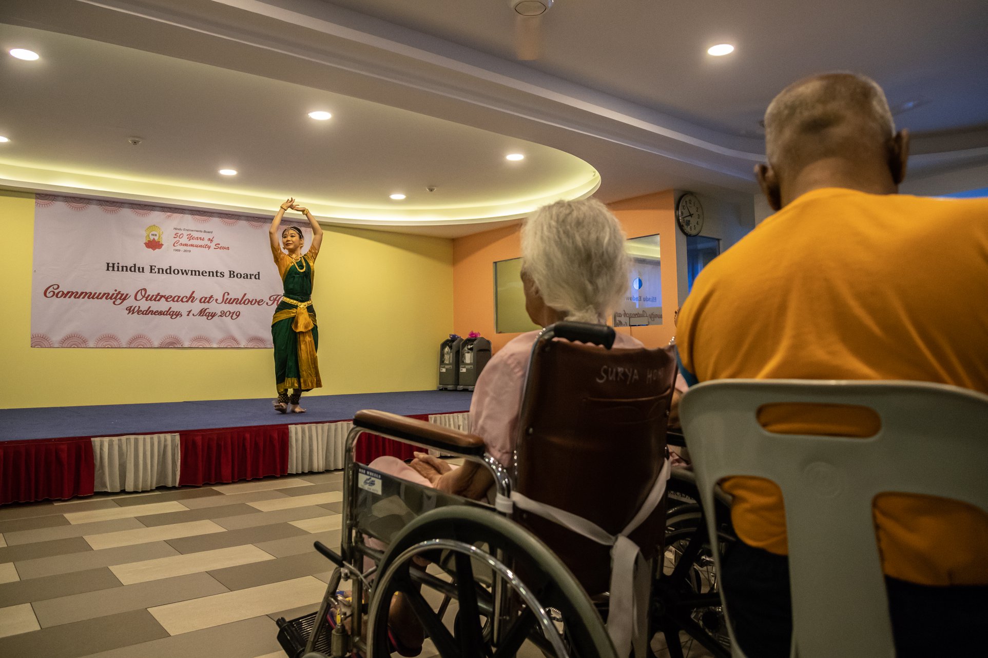Residents at Sunlove Home enjoying an Indian dance performance. Photo courtesy: Hindu Endowments Board