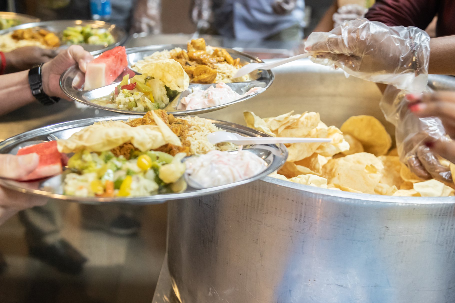 Volunteers from the Sri Mariamman Temple served lunch to residents at Sunlove Home. Photo courtesy: Hindu Endowments Board