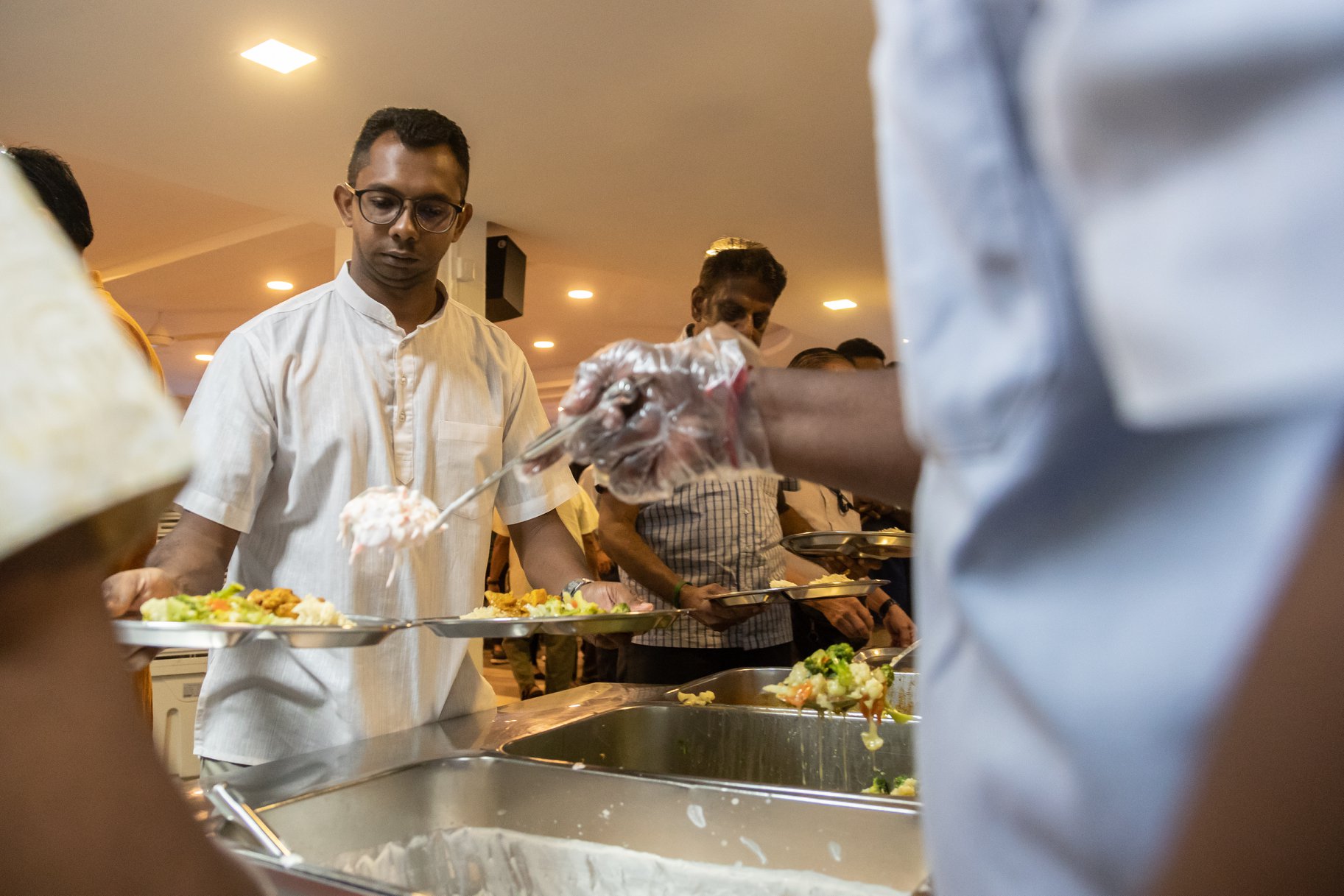 Volunteers from the Sri Mariamman Temple served lunch to residents at Sunlove Home. Photo courtesy: Hindu Endowments Board