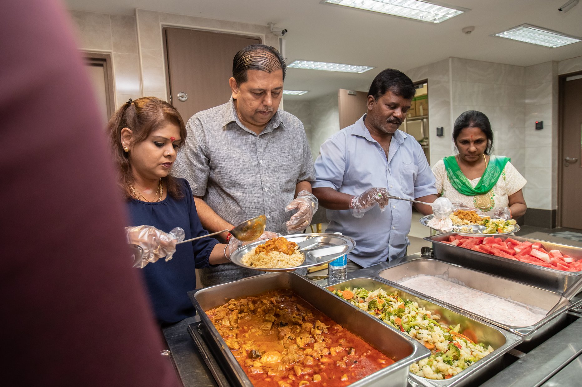 Volunteers from the Sri Mariamman Temple served lunch to residents at Sunlove Home. Photo courtesy: Hindu Endowments Board