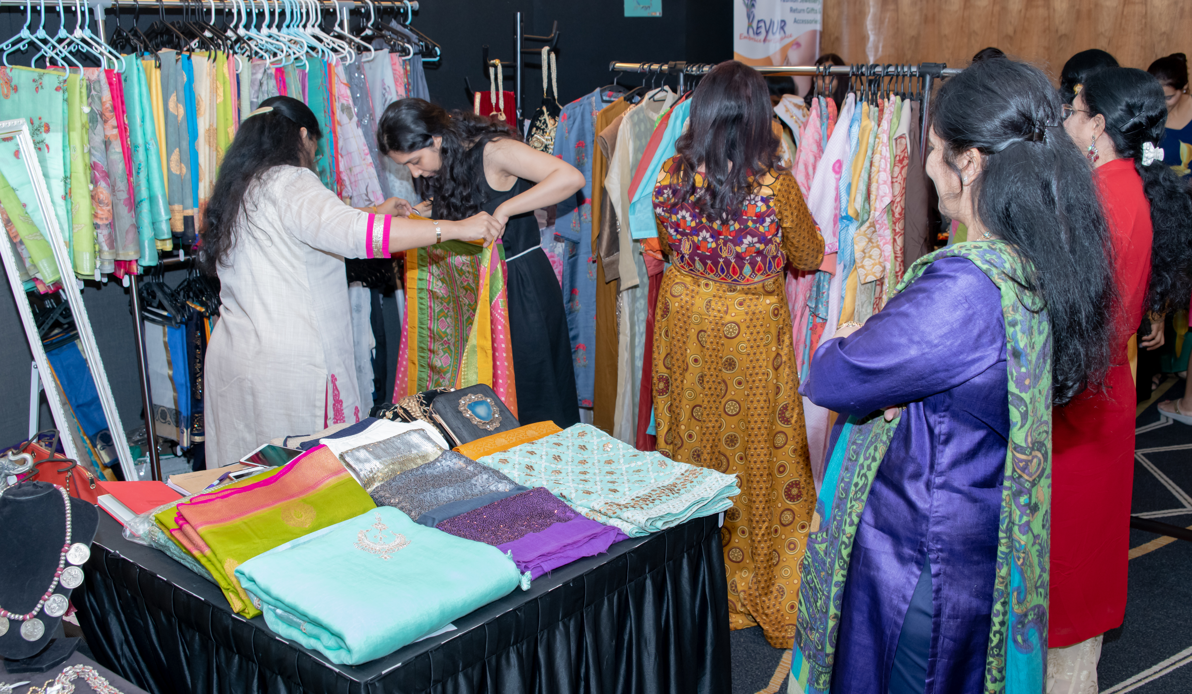 With such a colourful spread to choose from, the ladies here are busy trying on sarees and suits at the IWA Bazaar. Photo courtesy: Gargi Mazumdar