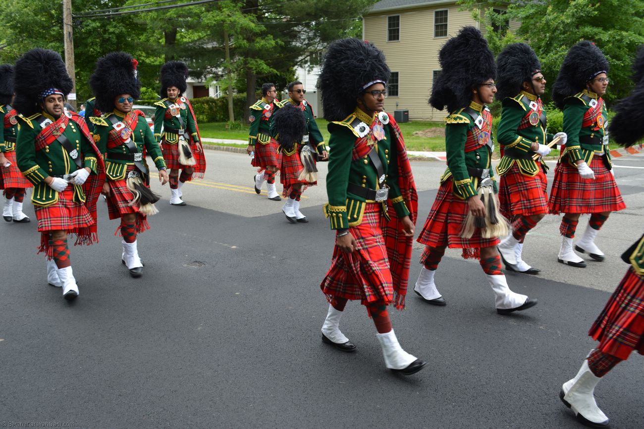 The Swamibapa Band members walk through streets with a pep in their step   (source: MSSGS