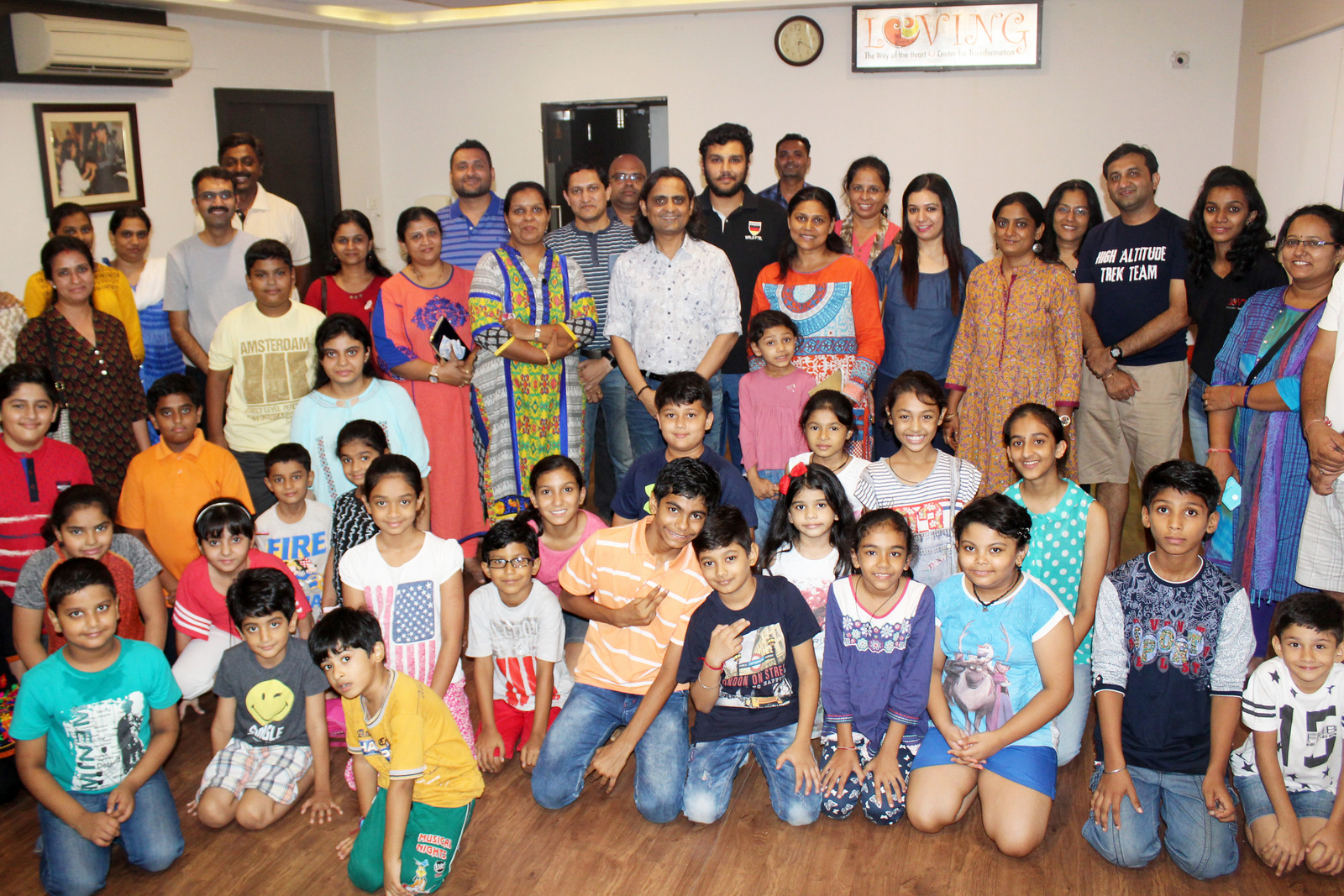 A group of happy parents with their children after the completion of the course at Loving Centre for Transformation. Photo courtesy: LCT