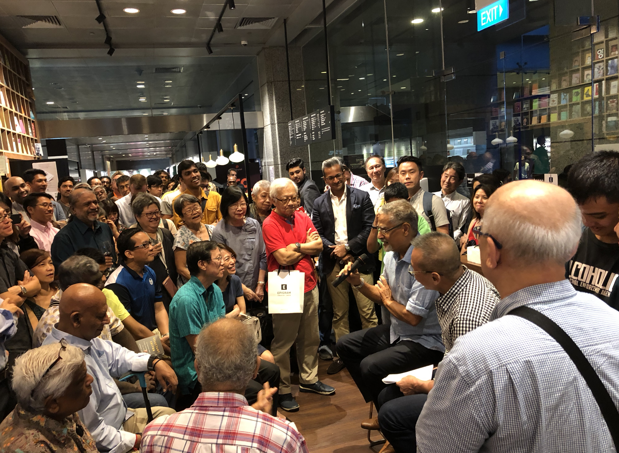PN Balji answers difficult questions posed by Channel NewsAsia's founding editor Woon Tai Ho at the book launch held at Huggs-Epigram Coffee Bookshop. Photo: Connected to India