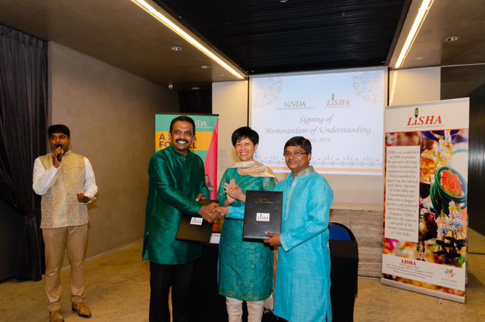 (from left) SINDA's Anbarasu Rajendran, Second Minister for Finance & Education Indranee Rajah and chairman of LISHA Rajakumar Chandra. 