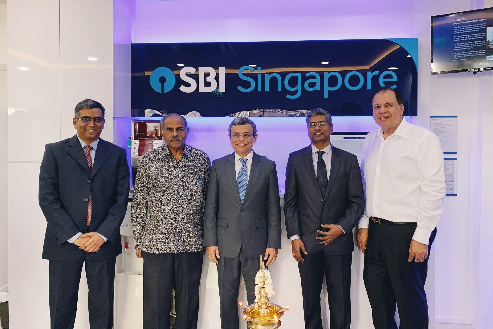 (from left) P. Jamneshwar, Chief Executive Officer, SBI Singapore; Ambassador K Kesavapany; High Commissioner of India to Singapore Jawed Ashraf; Kishore Kumar Poludasu, Country Head of SBI Singapore; and Narandas Gangaram, Radha Exports, at the launch of State Bank of India (SBI) Singapore's new Jurong East branch. Photo: Connected to India