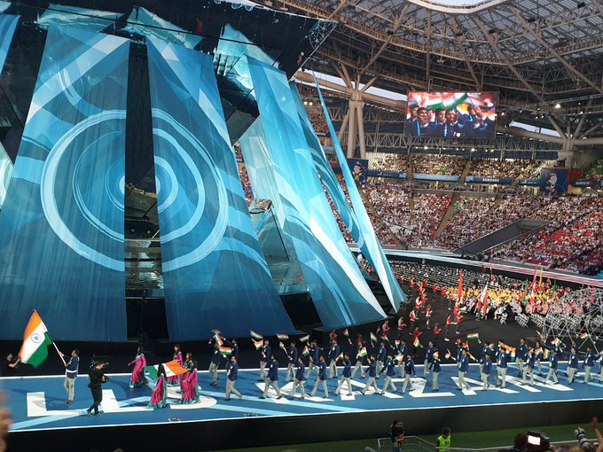 Team India walks down the aisle at the opening ceremony of the