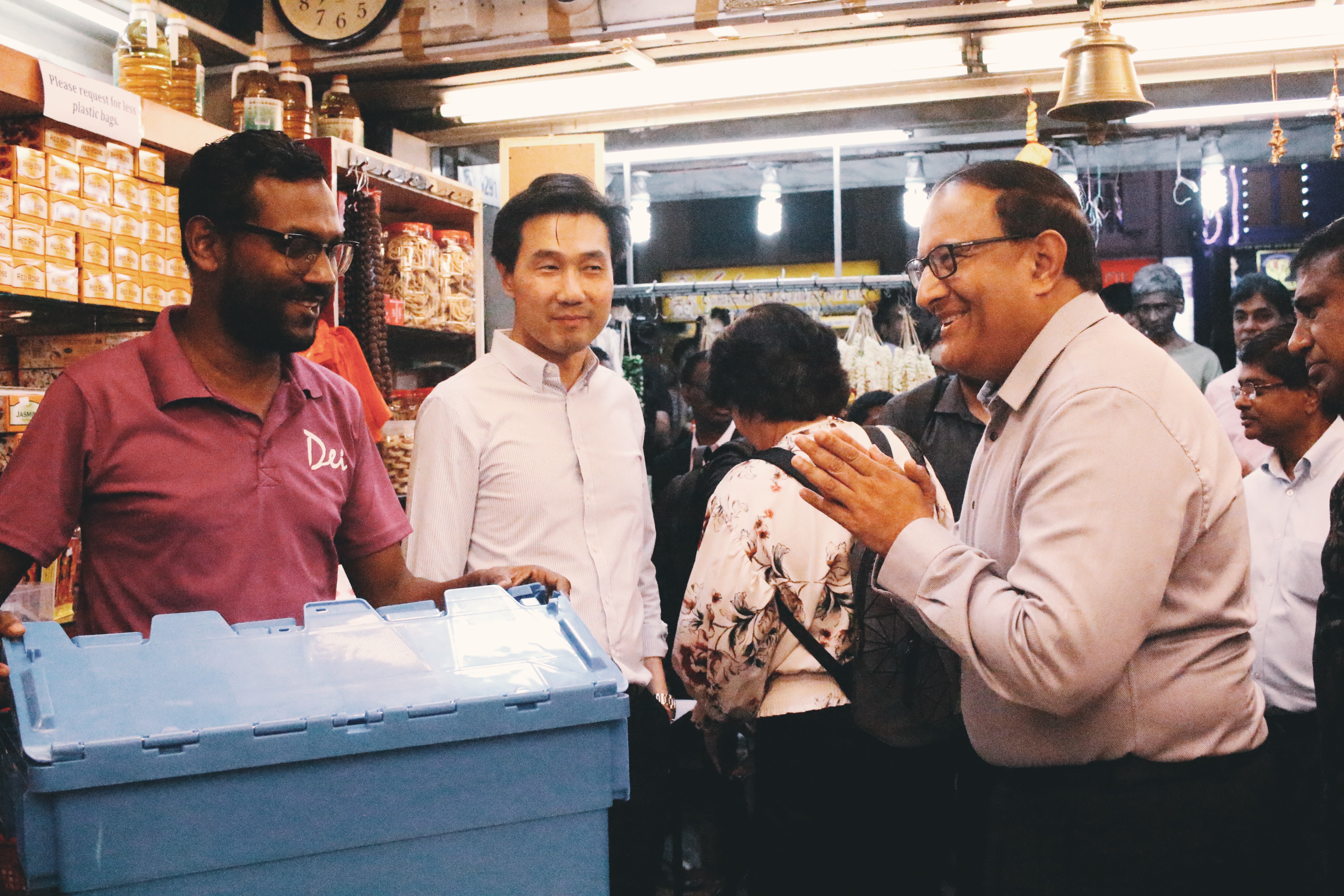 Minister Iswaran got curious about the cartons of flowers that just arrived at Sakthi Sangeetha. Photo: Connected to India