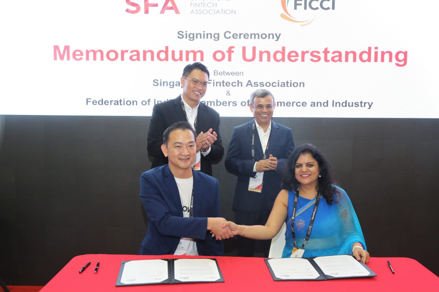 HE Jawed Ashraf, India’s High Commissioner to Singapore (2nd row, right) and Patrick Tay, Assistant Secretary General, NTUC and MP, West Coast GRC (2nd row, left) witnessing the MoU signing ceremony between SFA and FICCI at the 4th Singapore FinTech Festival 2019. Navita Myer, Director, FICCI Singapore (1st row, right) and Chia Hock Lai, president, SFA signed the MoUs on behalf of their organisations