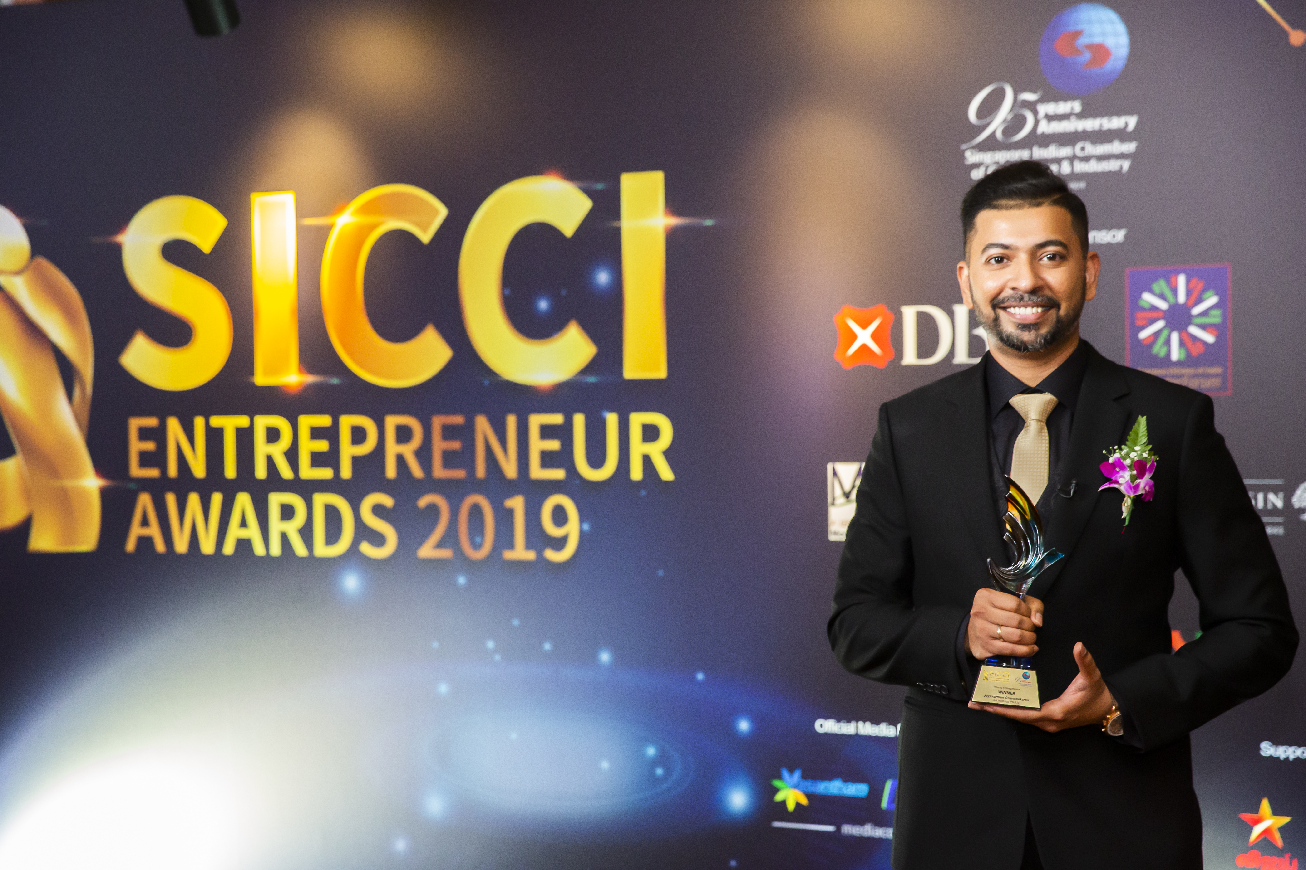 Jayavarman Gnanansekaran, CEO Dei Holding Pte Ltd poses with the  Young Entrepreneur Award at the 2019 SICCI Awards ceremony at MBS Singapore. Photo Courtesy: SICCI