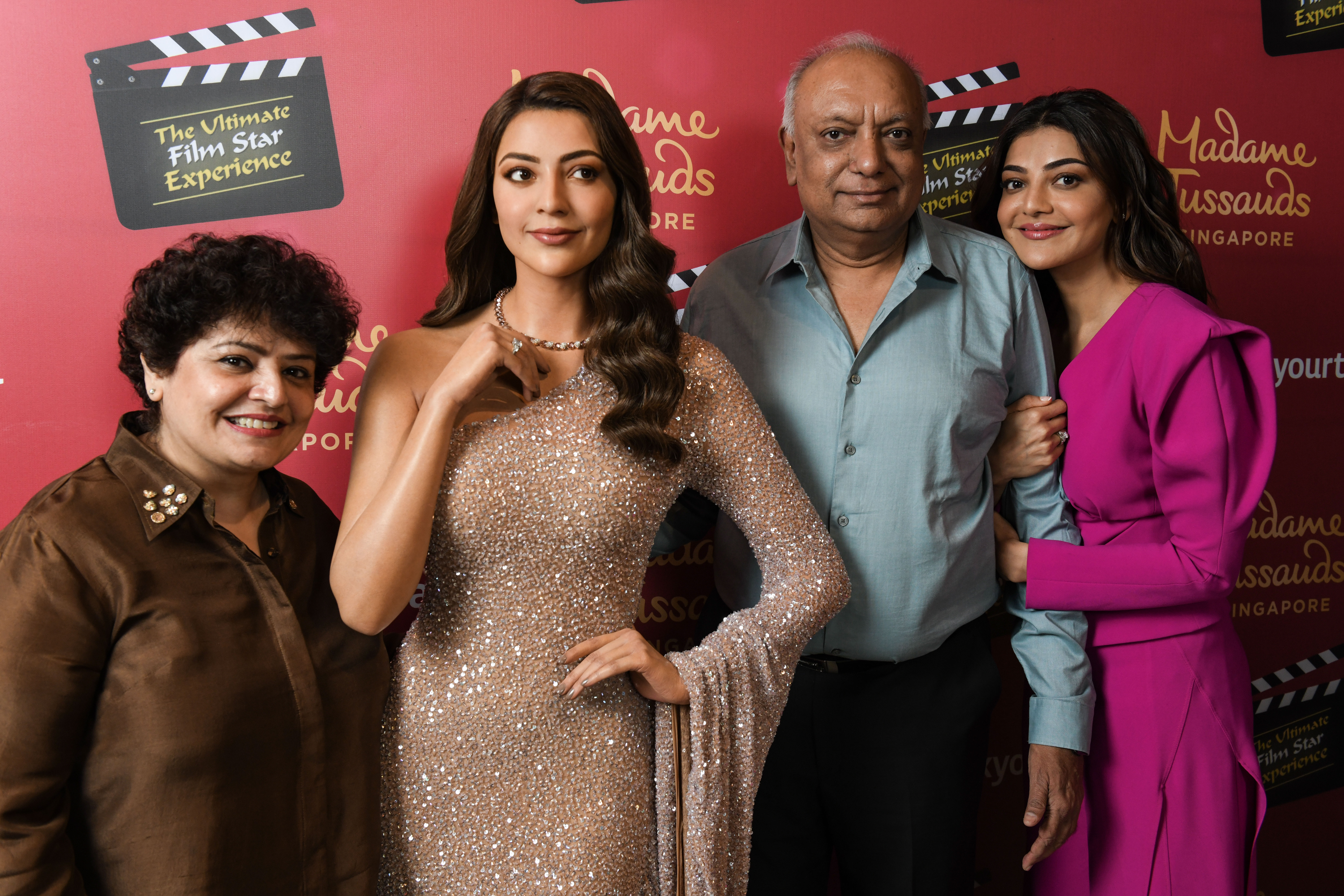 Kajal Aggarwal’s dad had tears in his eyes as he and her mom posed with her newly unveiled wax figure at Madame Tussauds Singapore. Photo Courtesy: Madame Tussauds Singapore 