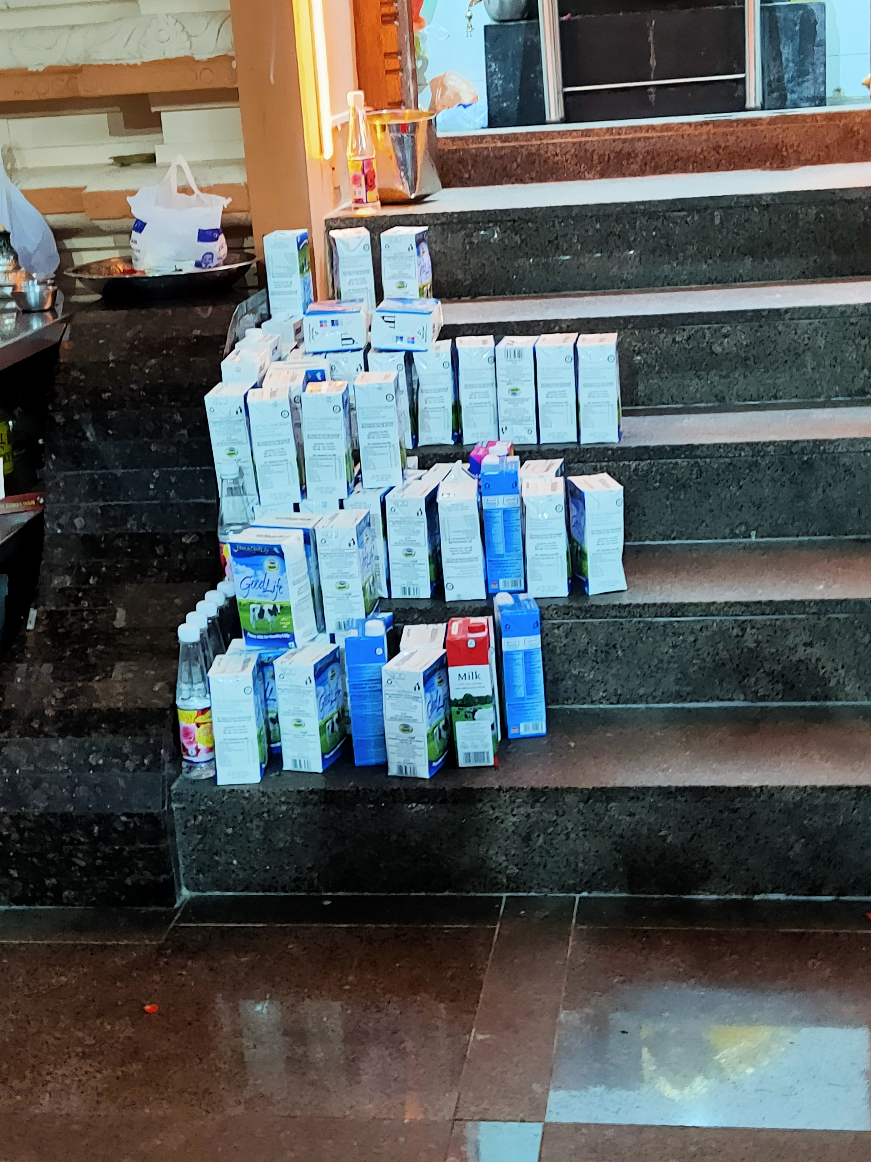 Milk packets offered by devotees await being offered to the deities. Photo: Connected to India