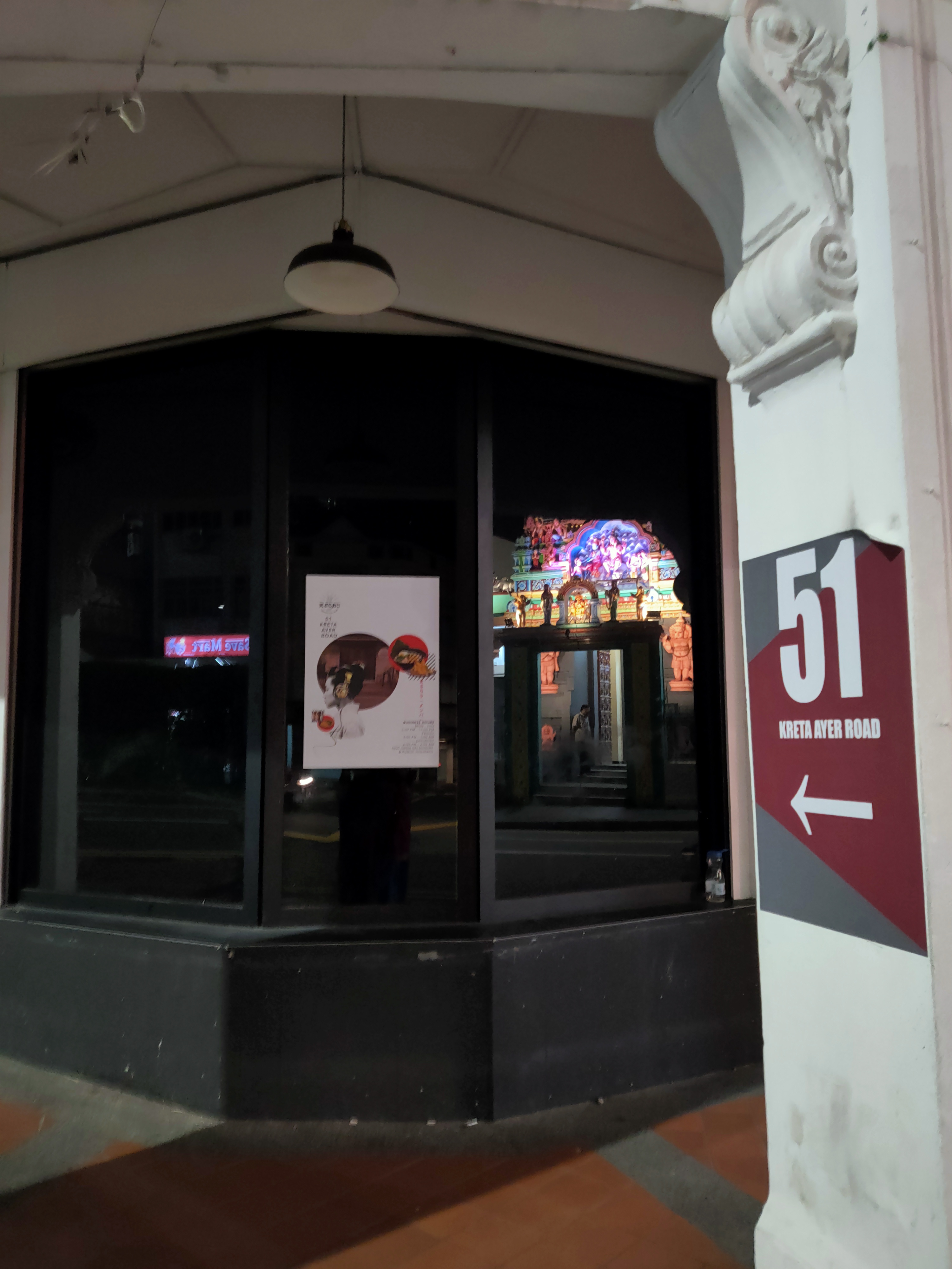 The Layan Sithi Vinayagar temple reflected in the glass of the shophouse oppsite it on Keong Saik Road. Photo:Connected to India