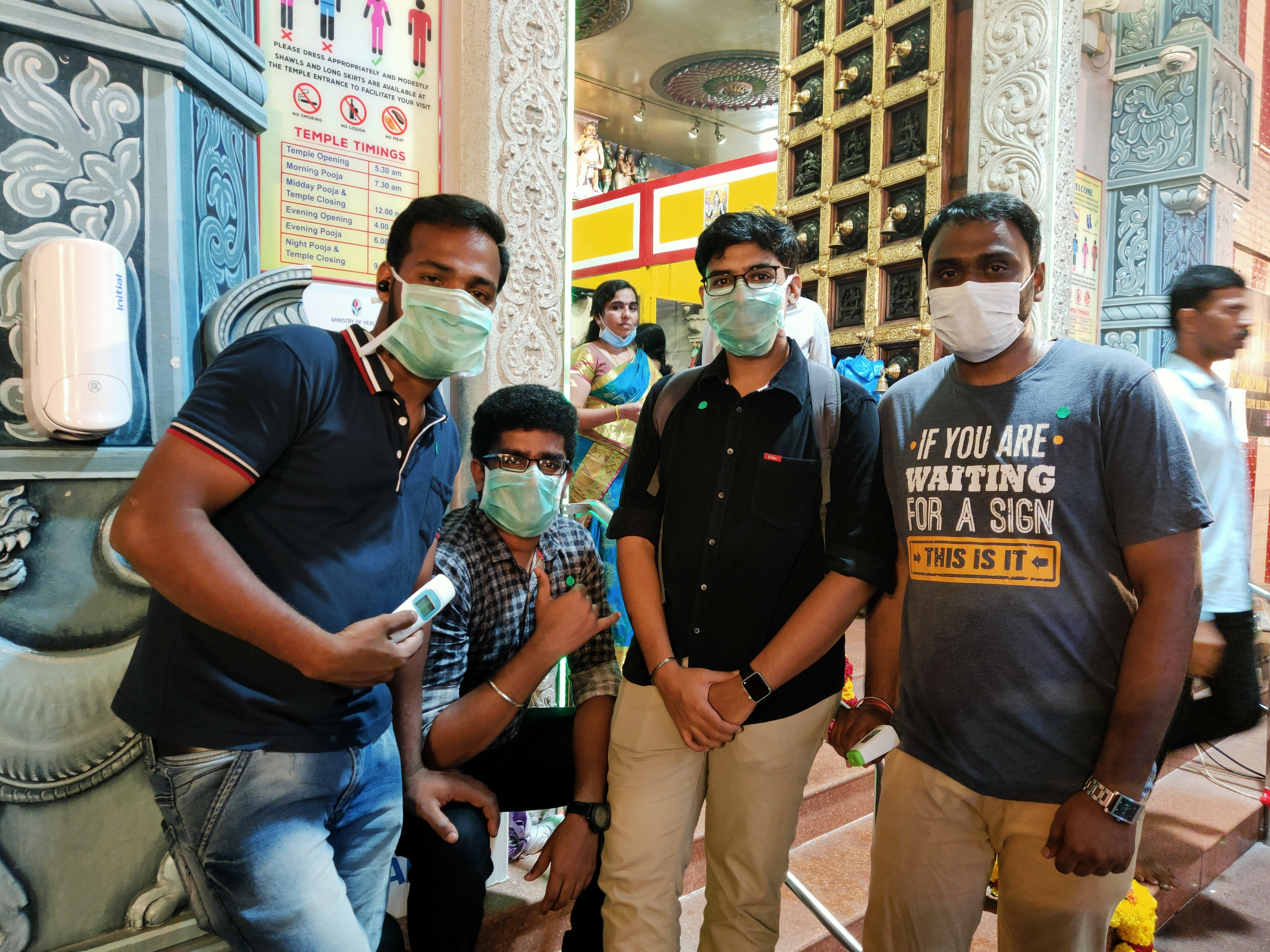 Volunteers manning mandatory temperature check points overnight at temples in Singapore on the ocassion of Mahashivratri. Photo: Connected to India