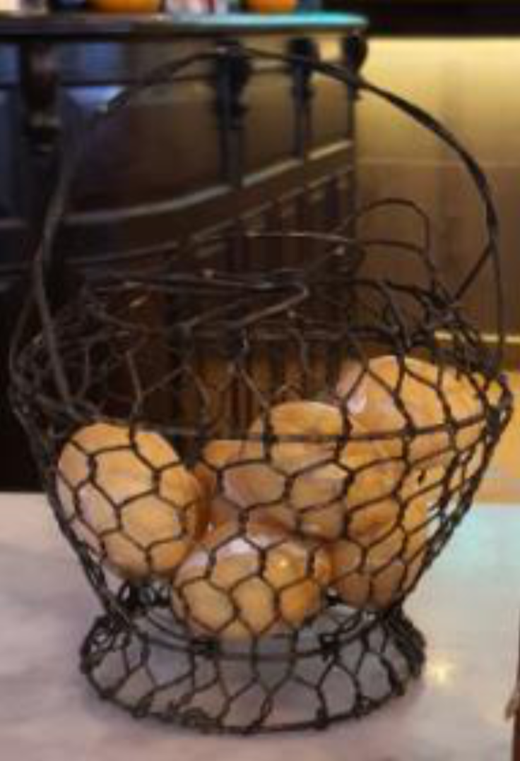 This metal basket was used to store eggs that would be cracked open and added to a piping hot bowl of chicken or pork porridge, which Loy Kee Best Chicken Rice still serves today. Photo courtesy: NHB