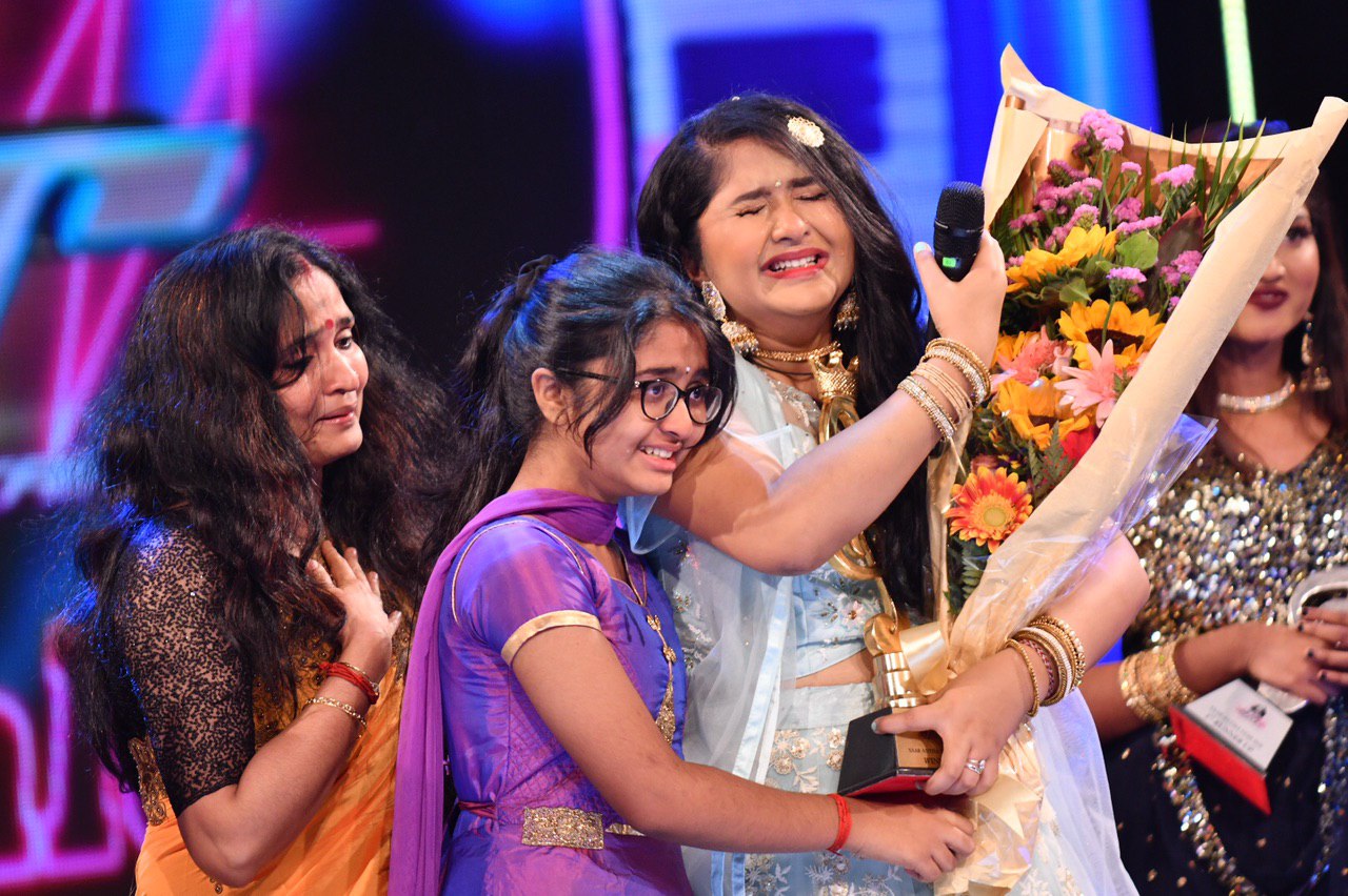 Meenakshy's winning moment with her mom and sister turned emotional as her dad couldn't make it from Dubai to Singapore due to COVID-19 travel restrictions. Photo Courtesy: Vasantham