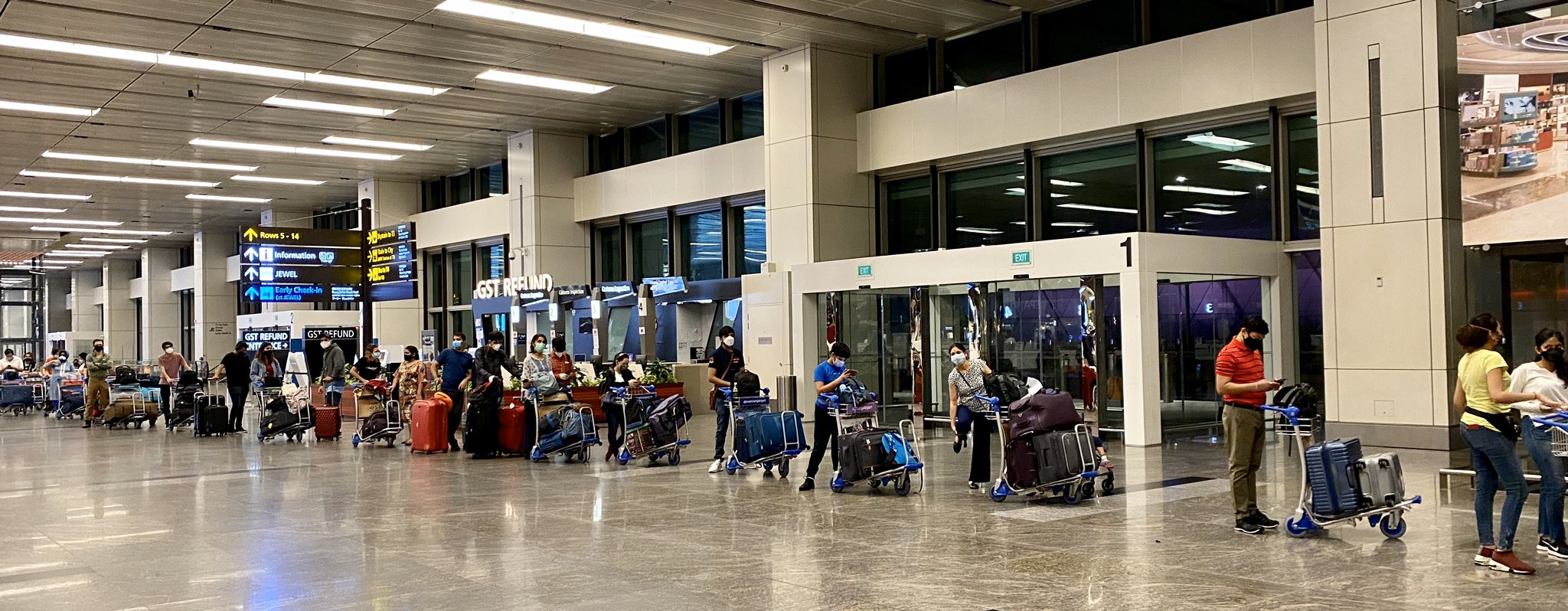 Indians stranded in Singapore boarding flight back home as repatriation mission begins. Photo courtesy: Twitter/@IndiainSingapore