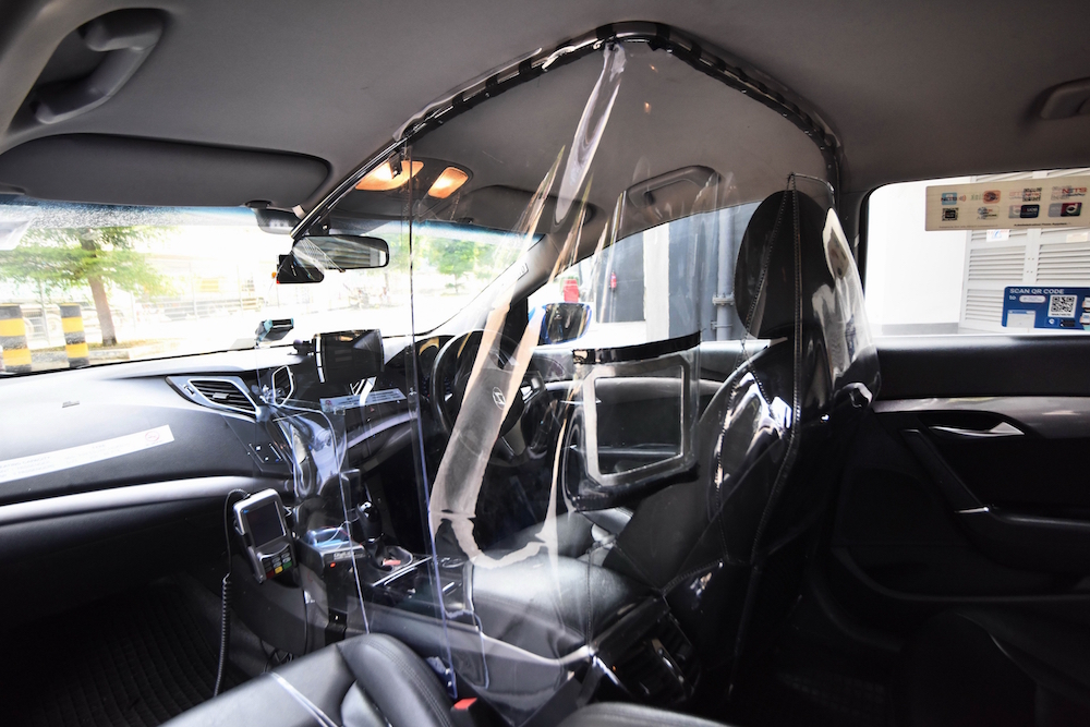 Called V-shield, the shield has two “window” openings for passengers to make payment. Photo courtesy: ComfortDelGro