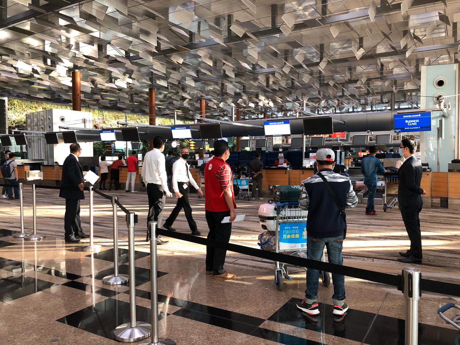A passenger checking in for his flight. Photo courtesy: Changi Airport