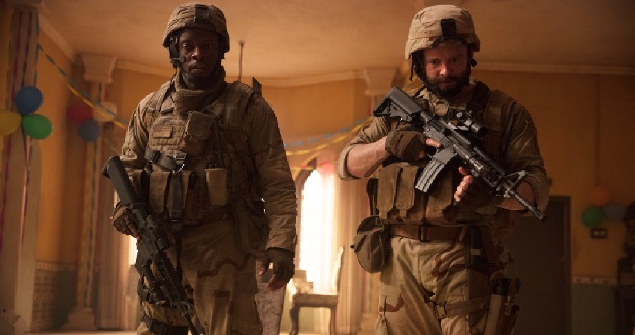 American soldiers (Reginald L Barnes and Nicholas Scholz) represent the ugly face of US military invasion as they barge into the Tiwari home. Photo Courtesy: Zee5