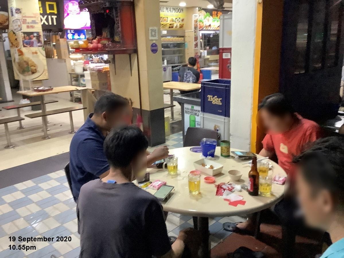 On 19 September 2020, officers observed patrons consuming alcohol at 10.55pm at two tables in the outdoor refreshment area at Blk 261, Serangoon Central Drive. Photo courtesy: Singapore Food Agency