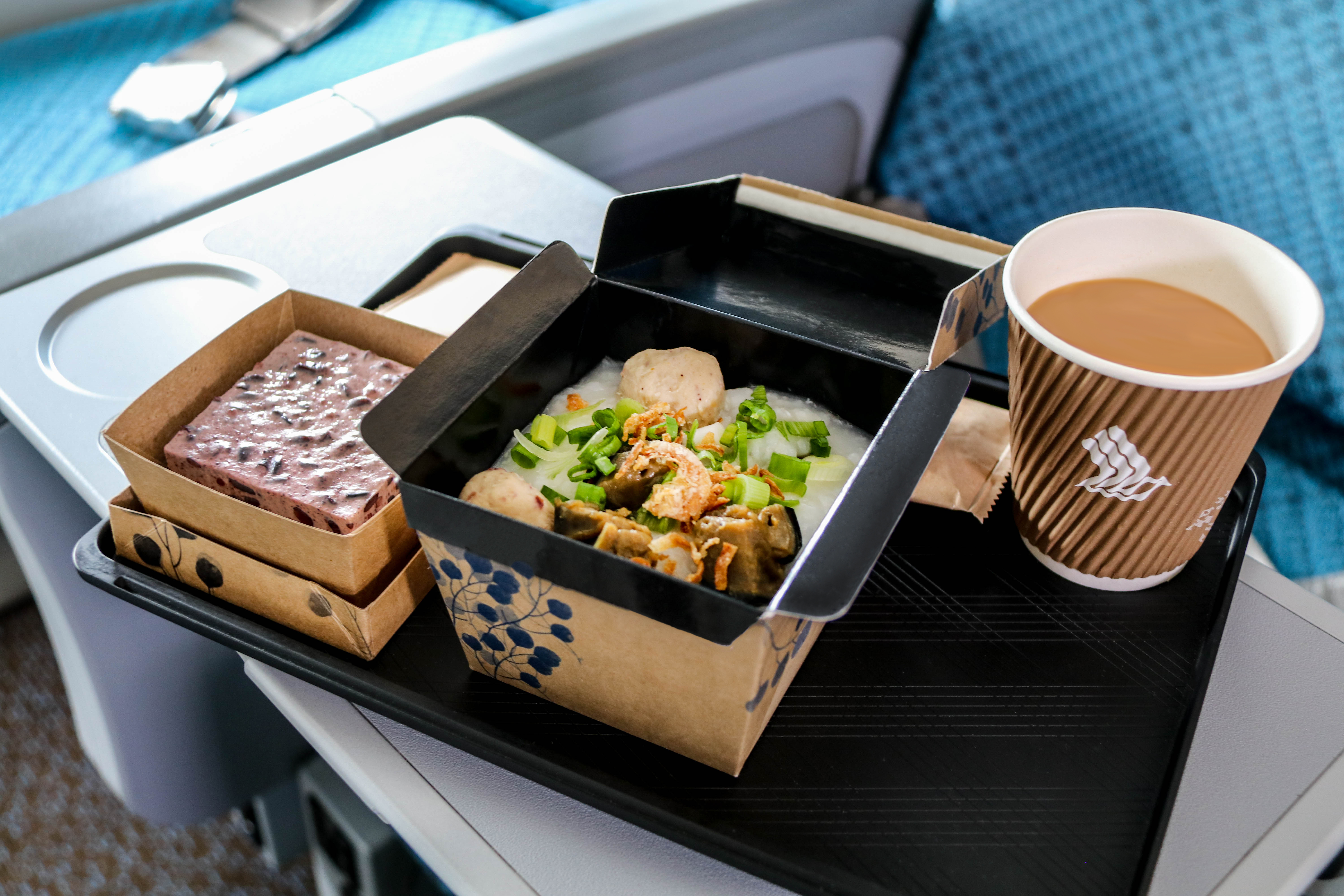 Congee and Pulut Hitam in new eco-friendly packaging, which will reduce amount of single-use plastics on the meal tray by 80 per cent by weight. Photo courtesy: SIA