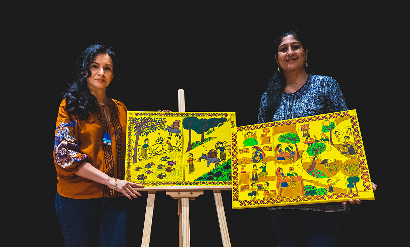 Kamini (left) with Kumuda (right) with the illustrations which were hand-painted on canvas and then filmed separately.  