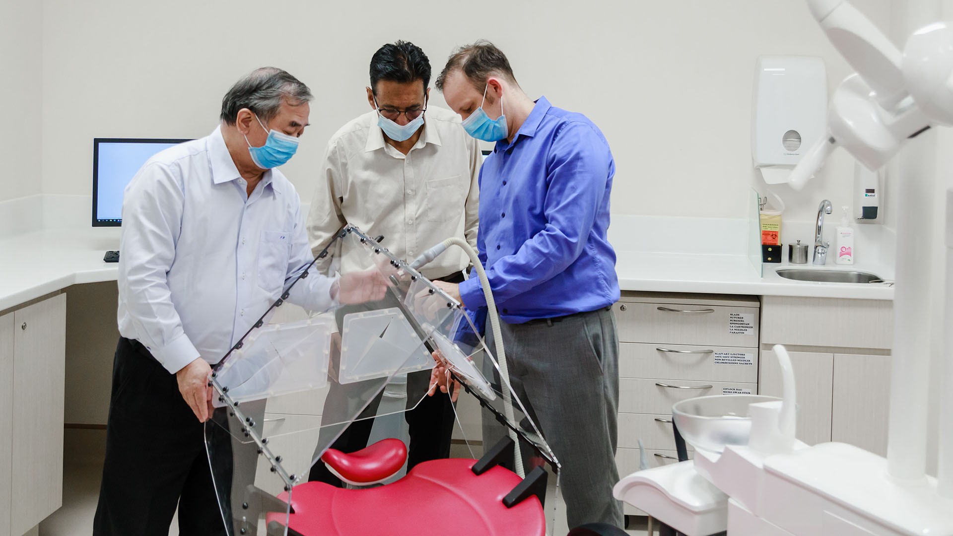 The Dental Droplet and Aerosol Reducing Tent (Dental DART) was developed by NUS researchers (from left) Professor Freddy Boey, Mr Sudarshan Anantharaman, Associate Professor Vinicius Rosa and their team. Photo courtesy: NUS