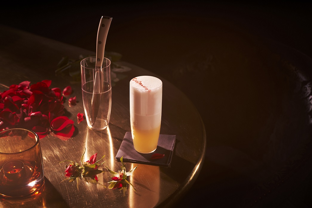 False Alibi, a blend of Beluga Gold Line vodka, Shaw +  Smith Sauvignon Blanc, passionfruit, gum arabic, white balsamic, lemon, egg white and soda. Photo: Raffles Hotel Singapore