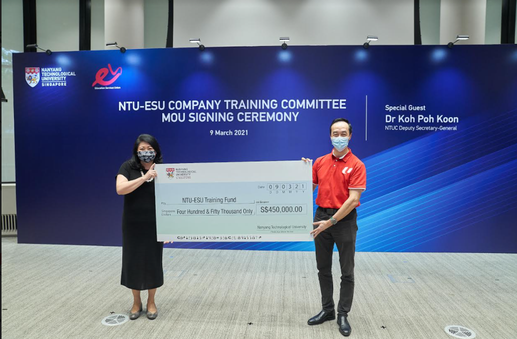 Ms Tan Aik Na, NTU Senior Vice President (Administration), presented a cheque to NTUC Deputy Secretary-General Dr Koh Poh Koon, signifying the University’s contribution to the new training fund. (Credit: NTU)
