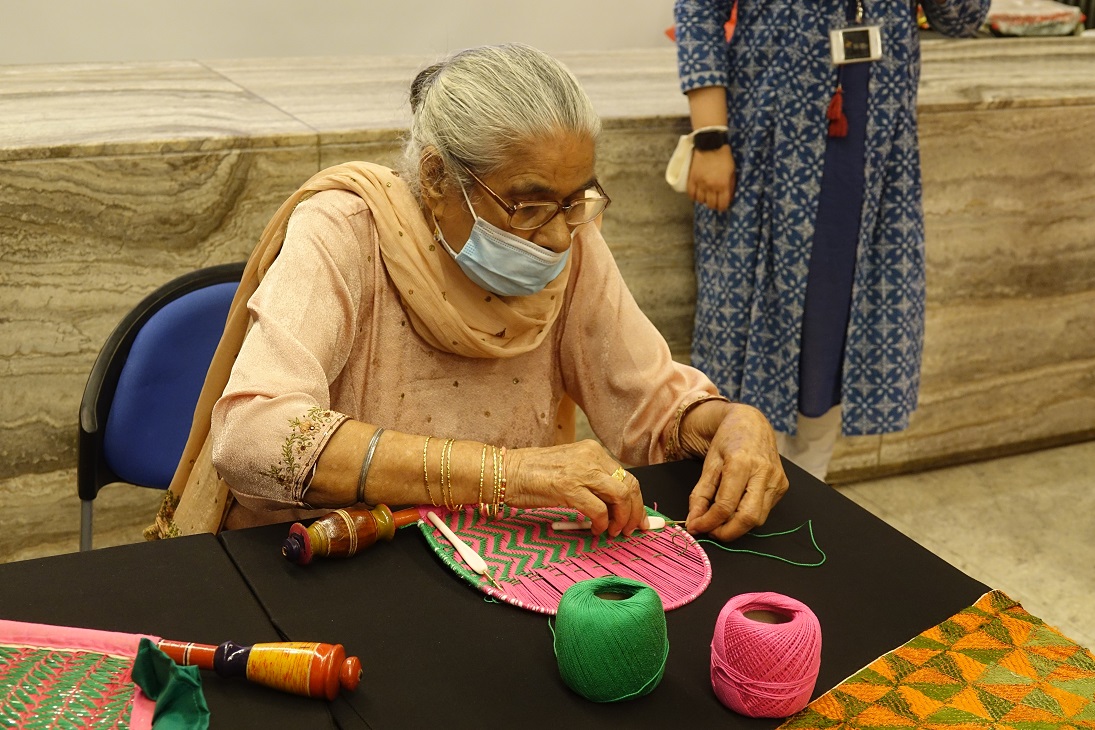 A member of Singapore's Sikh community weaving a traditional pakkhi or hand fan. Photo courtesy: IHC
